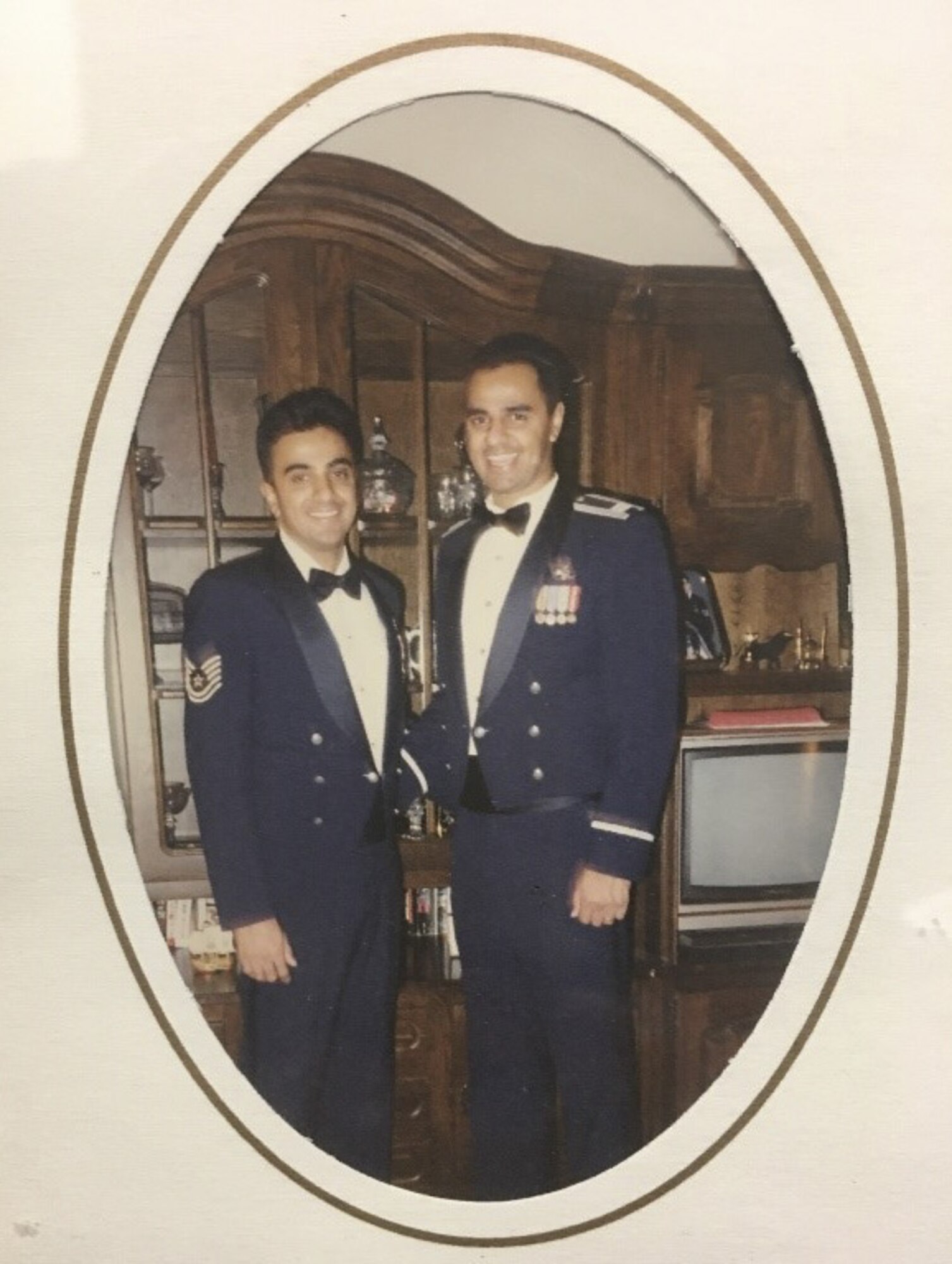 Mustak Keval, 60th Force Support Squadron Airman and Family Readiness Center flight chief, left, poses for a photo with his brother, Retired Lt. Col. Azad Keval, June 1996. Both Azad and Mustak served until retirement in the U.S. Air Force. (Courtesy photo)