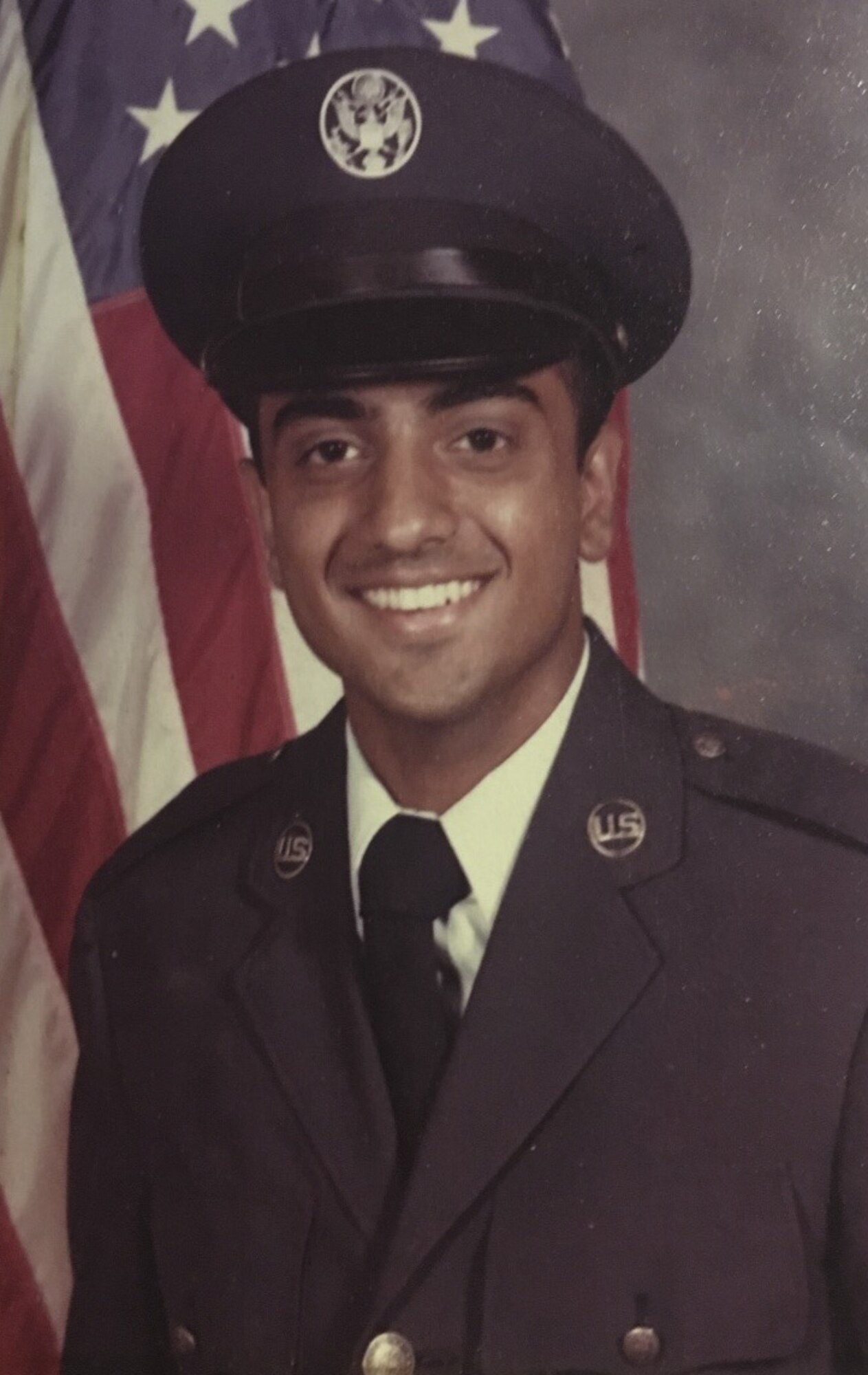 Mustak Keval, 60th Force Support Squadron Airman and Family Readiness Center flight chief, poses for a Basic Military Training photo at Lackland Air Force Base, Texas, September 1980. Keval, a Ugandan refugee spent more than 20 years in the U.S. Air Force and continues to serve Airmen and their families at the AFRC. (Courtesy photo)