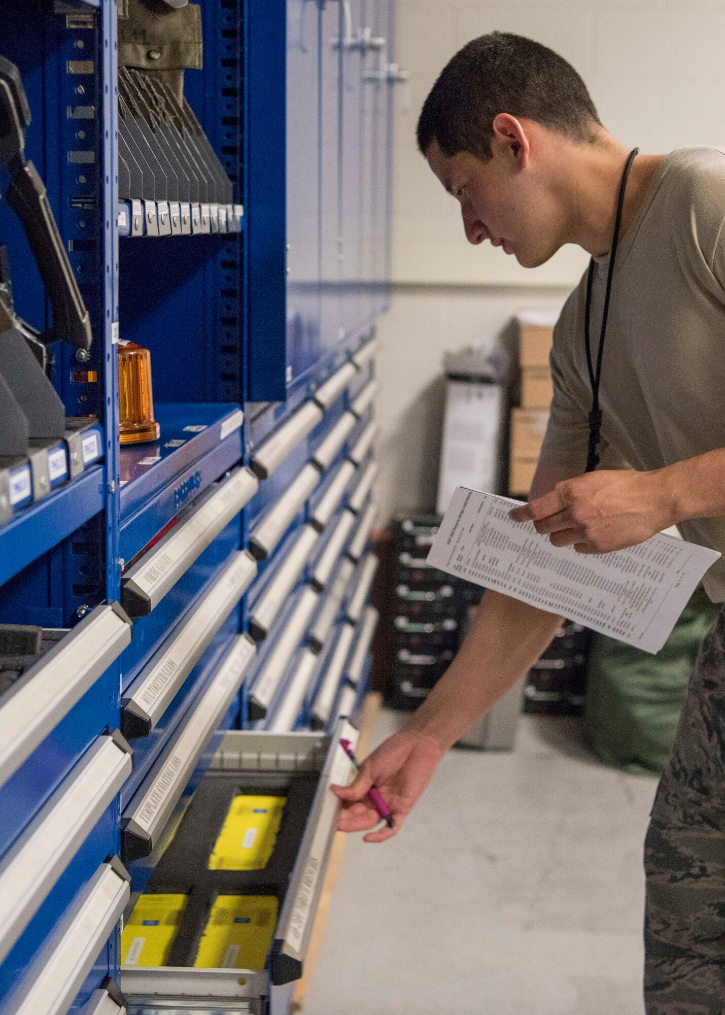 Airman 1st Class Daren Abad, a 525th Aircraft Maintenance Unit F-22 Raptor crew chief support technician, performs tool and equipment inventory at Joint Base Elmendorf-Richardson, Alaska, July 19, 2018. Abad is responsible for the issue and control of more than 10,000 tools during one of three shift inventories.