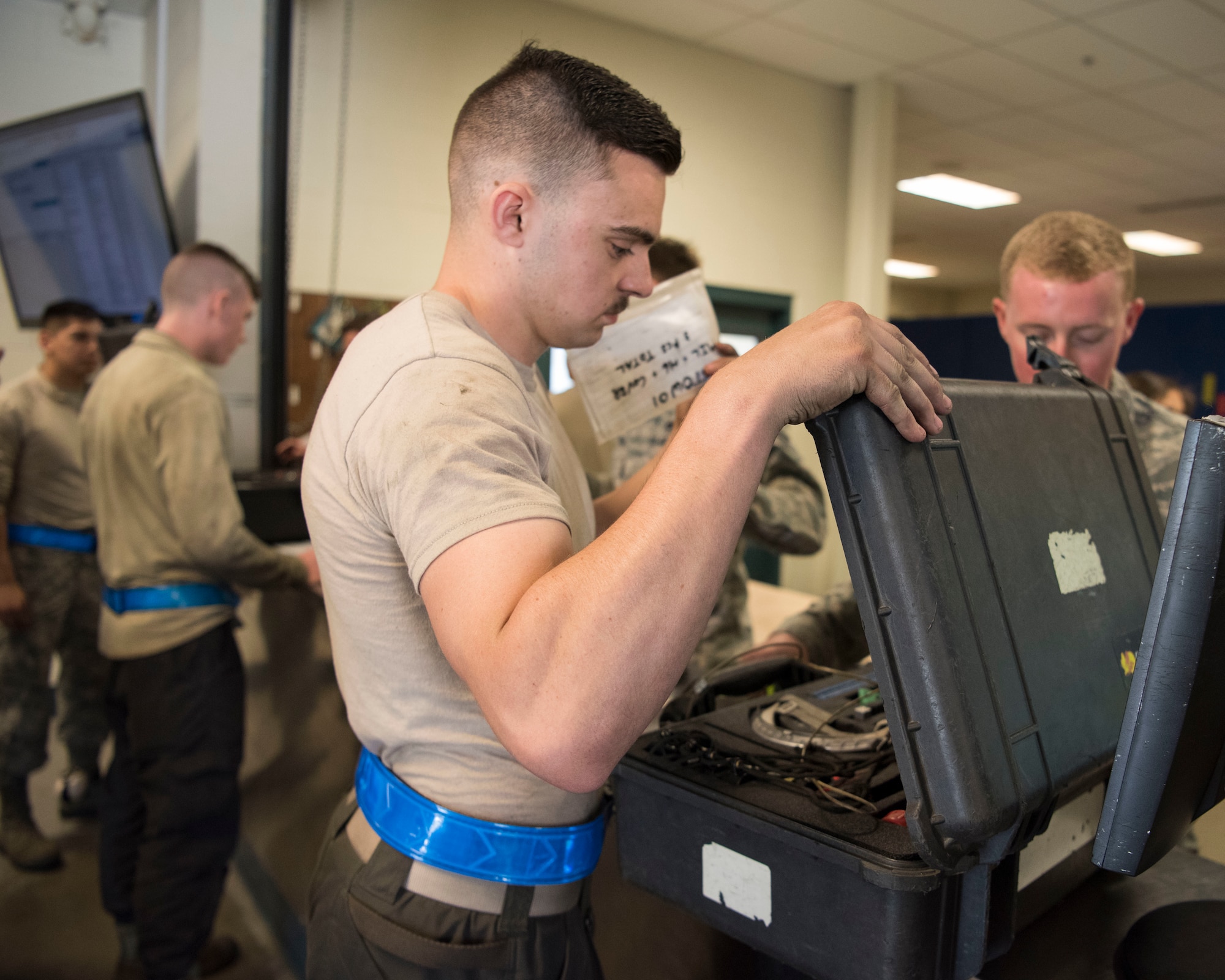 Airman 1st Class Ian Pierce, a 525th Aircraft Maintenance Unit F-22 Raptor assistant dedicated crew chief, turns in equipment during a tool and equipment shift inventory at Joint Base Elmendorf-Richardson, Alaska, July 19, 2018. Pierce is responsible and accountable for any tools he checks out while performing maintenance on the aircraft.