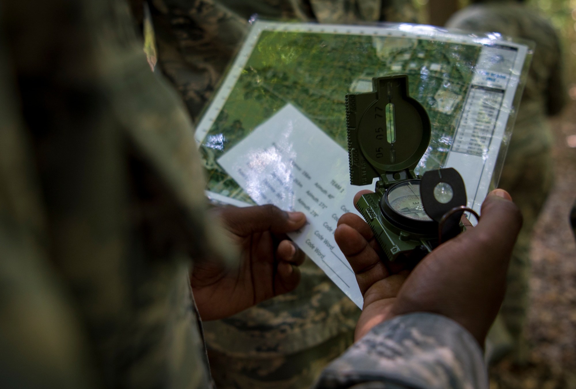 U.S. Air Force Senior Airman Adrian Richardson, 633rd Civil Engineer Squadron operations management journeyman, practices land navigation during Prime Base Engineer Emergency Force training at Joint Base Langley-Eustis, Virginia, July 19, 2018.