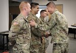 Brig. Gen. Richard Kim, Deputy Commanding General of Operations, United States Army North (ARNORTH), thanks one of four Soldiers with the West Virginia National Guard (WVNG) World Scout Jamboree (WSJ) planning team July 18, 2018, at the Glen Jean Armory in Glen Jean, West Virginia. The Soldiers were instrumental in facilitating a two-day table top exercise to discuss the 2019 WSJ being held at the Summit Bechtel Family National Scout Reserve in Fayette County, West Virginia next year. (U.S. Army National Guard photo by Sgt. Zoe Morris)