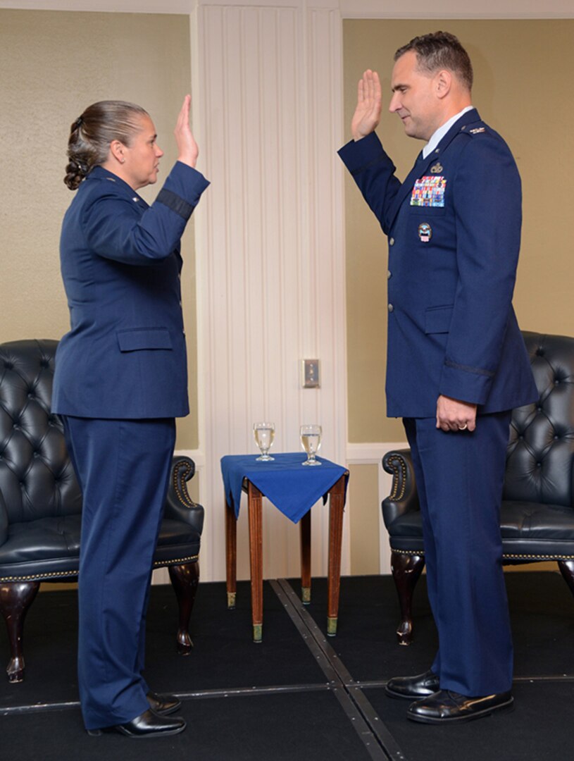 Brig. Gen. Hurry administers oat of office to Col.  Malec