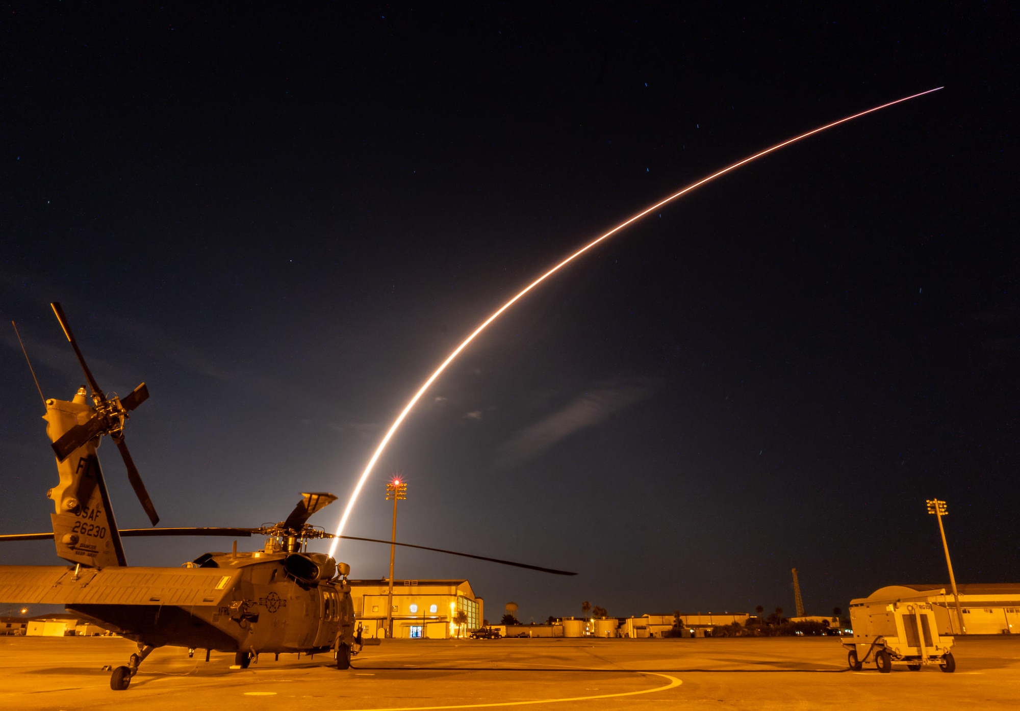 On Sunday, July 22, 2018, SpaceX, a commercial leader in aerospace, successfully launched the Telstar 19 VANTAGE satellite from Space Launch Complex 40 at Cape Canaveral Air Force Station, Florida. Prior to the launch, Reserve Citizen Airmen from the 920th Rescue Wing, Patrick Air Force Base, Florida, took off in an HH-60G Pave Hawk helicopter, to secure the Eastern Range ensuring there was no one in harm's way while the rocket lifted off. As the rocket was launching at 1:50 a.m., an additional Pave Hawk with the 920th's fleet, is shown parked on the PAFB tarmac. (U.S. Air Force photo by Staff Sgt. Wes Henry)