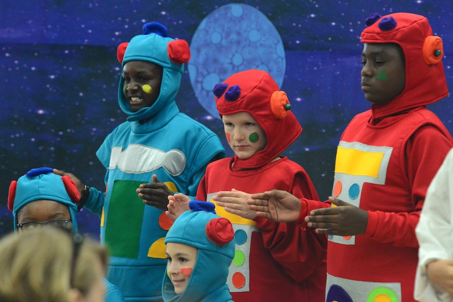 The five robots of Lapunta, portrayed by Mi’ky Neal, Roderick Freeman, Alec Mutter, Parker Cotner and Joseph Coake, play the role of evil henchmen during “Gulliver’s Travels” July 20, 2018, at Dover Air Force Base, Del. Later, these same characters helped teach math and science to the other aliens in the cosmos. (U.S. Air Force photo by Airman 1st Class Dedan D. Dials)