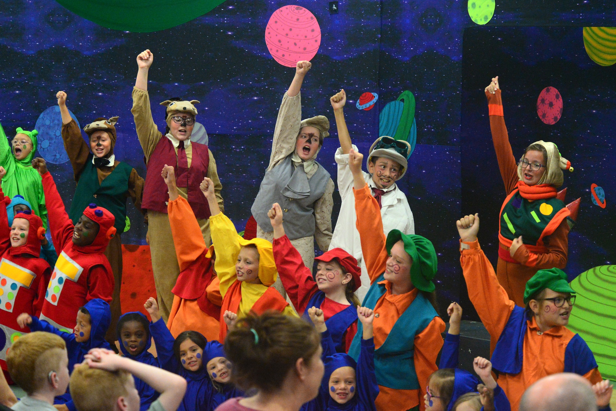 A group of children act out the final scene in Missoula Children’s Theatre’s production of “Gulliver’s Travels” July 20, 2018, at Dover Air Force Base, Del. This scene marked the end of the theatre company’s visit to the base. (U.S. Air Force photo by Airman 1st Class Dedan D. Dials)