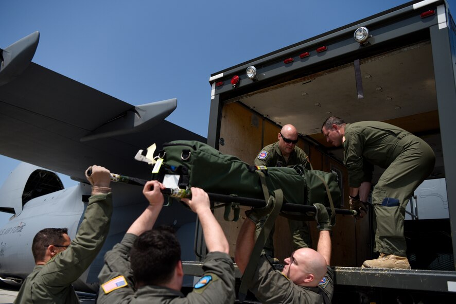 Flight nurses and flight medics from the Delaware Air National Guard 142nd Aeromedical Evacuation Squadron load an in-flight kit onto the high lift truck July 12, 2018, at Dover Air Force Base, Del. The kit includes a wide array of medical equipment that could be used on the aircraft in an emergency situation. The 142nd AES is stationed at New Castle Air National Guard Base, Del. (U.S. Air Force photo by Airman 1st Class Zoe M. Wockenfuss)