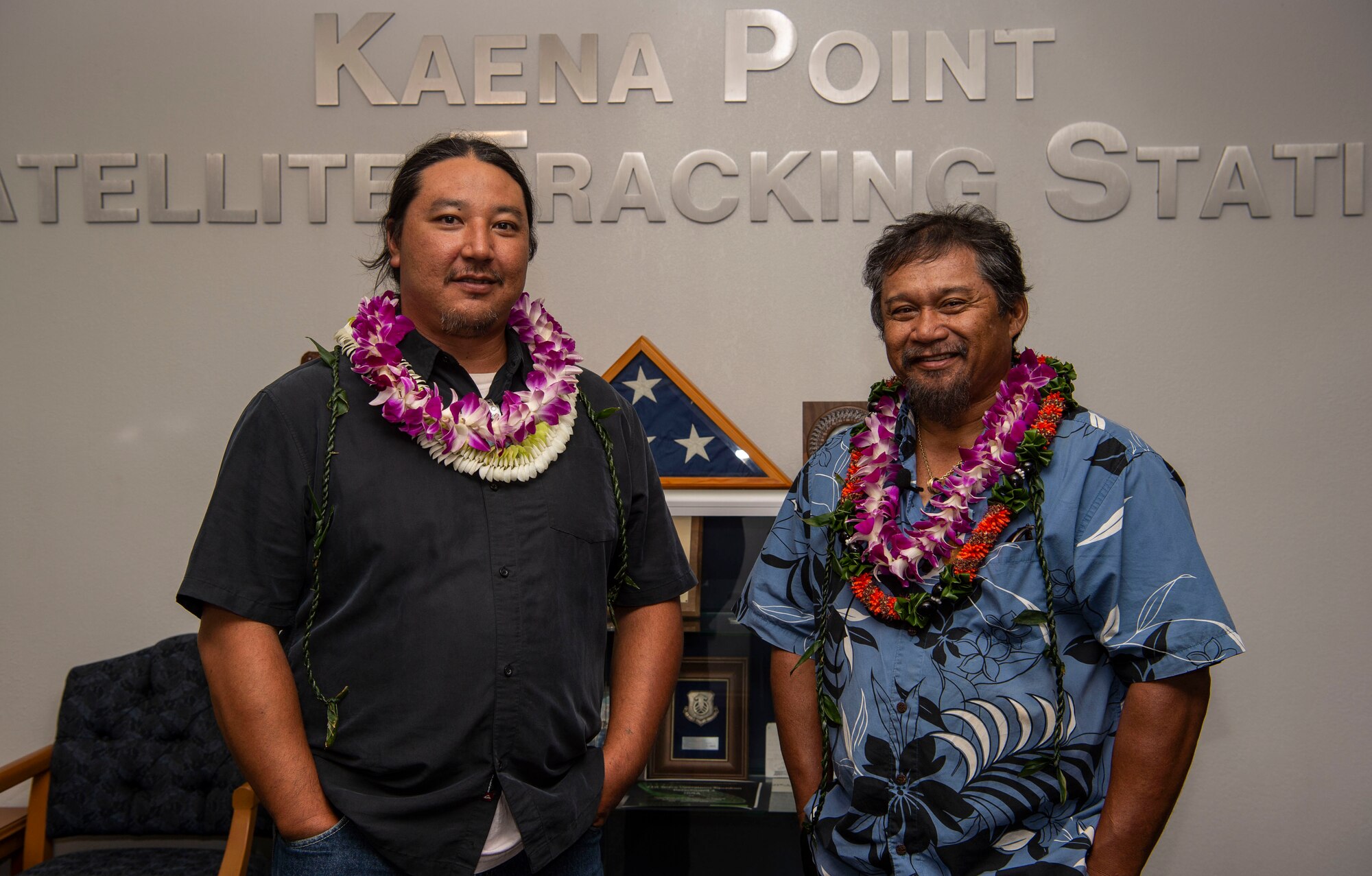 Jason Fukumoto, Detachment 3, 21st Space Operations Squadron electrician, and Robin Albios, Det. 3, 21st SOPS heating, ventilation and air conditioning specialist, pose for a photo after receiving the Air Force Civilian Award for Valor at the Kaena Point Satellite Tracking Station, Hawaii, July 23, 2018. Two years ago, Fukumoto and Albios provided medical aid to a state of Hawaii volunteer field crew member who suffered from smoke inhalation during a fire at the Kuaokala Game Management Area. (U.S. Air Force photo by Tech. Sgt. Heather Redman)