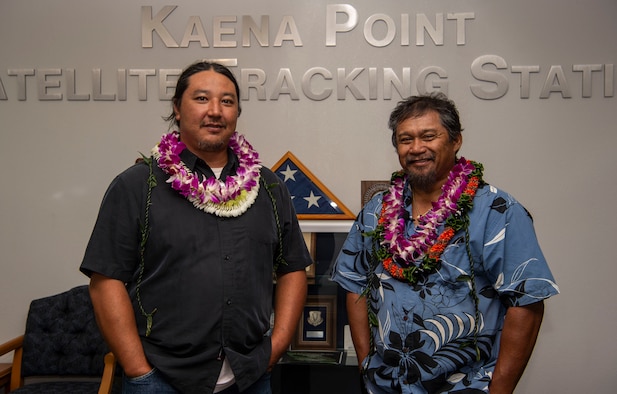 Jason Fukumoto, Detachment 3, 21st Space Operations Squadron electrician, and Robin Albios, Det. 3, 21st SOPS heating, ventilation and air conditioning specialist, pose for a photo after receiving the Air Force Civilian Award for Valor at the Kaena Point Satellite Tracking Station, Hawaii, July 23, 2018. Two years ago, Fukumoto and Albios provided medical aid to a state of Hawaii volunteer field crew member who suffered from smoke inhalation during a fire at the Kuaokala Game Management Area. (U.S. Air Force photo by Tech. Sgt. Heather Redman)