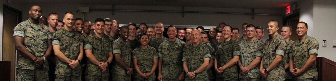 USAG CAMP HUMPHREYS, Korea – Sgt. Maj. Anthony A. Spadaro (center), U.S. Pacific Command senior enlisted leader, with Marines from U.S. Marine Corps Forces Korea, after speaking with them about the current environment on the peninsula here, July 12. Spadaro spent the day at MARFORK motivating the Marines and talking about his experiences as a leader in the Asian Pacific as well as his thoughts on the current climate. (U.S. Marine Corps photo by Sgt. Nathaniel Hanscom/Released)