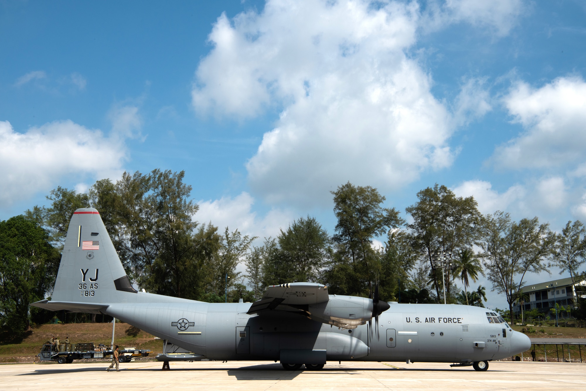 A U.S. Air Force C-130J Super Hercules sites on the Kuantan Air Base flight line to pick up equipment during Exercise Cope Taufan 18 (CT 18) in Malaysia, July 20, 2018. CT18 is a Pacific Air Forces-sponsored, bilateral, tactical airlift exercise that involves U.S. and Malaysian military forces. The biennial exercise is designed to advance interoperability between the two forces and allow for the exchange of airlift and airdrop, close air support and sir superiority techniques. (U.S. Air Force photo by Tech. Sgt. Michael Smith)