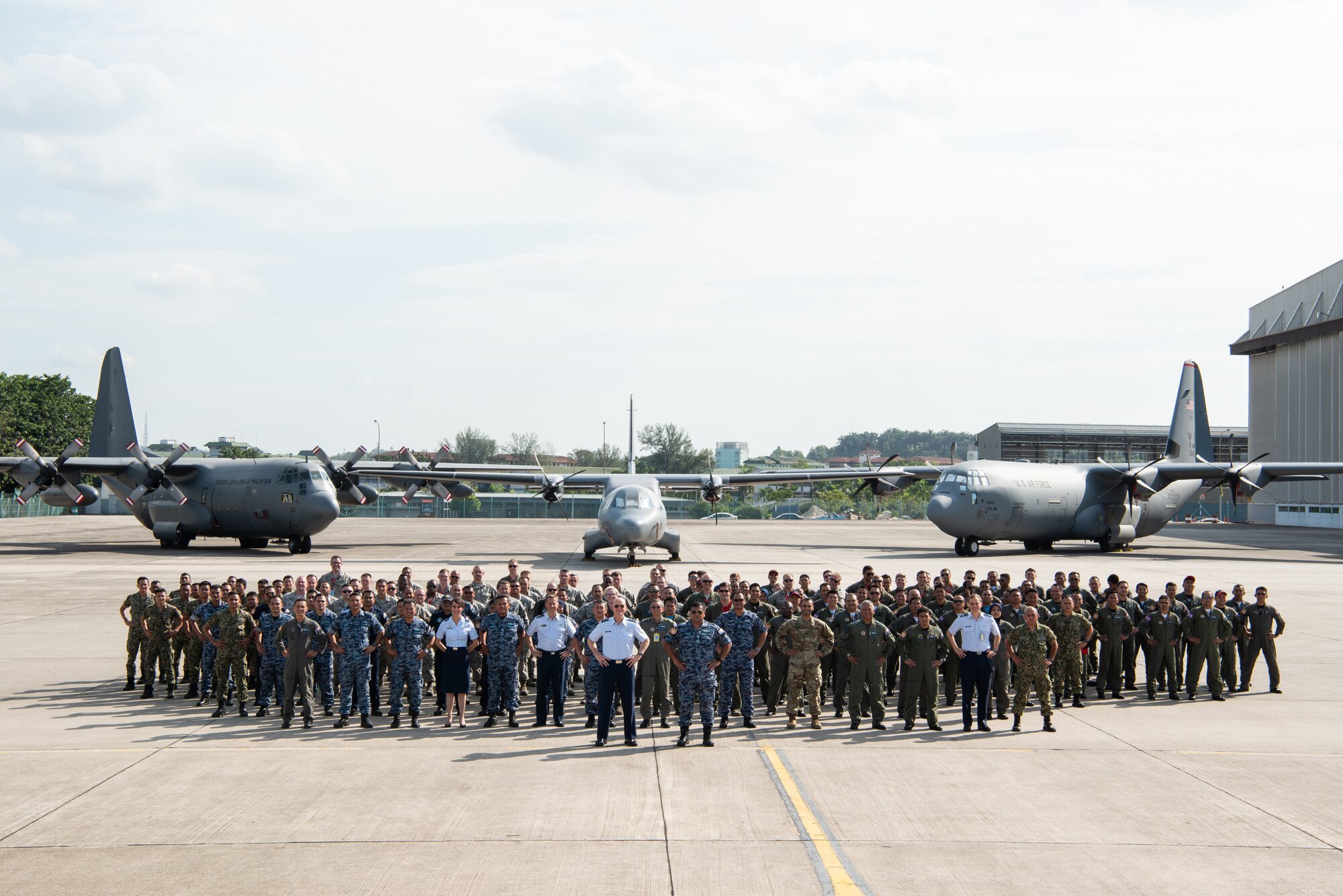 Participants of Cope Taufan 18 (CT18) pose for a group photo at Subang Air Base, Malaysia, July 20, 2018. CT18 provides an excellent opportunity to improve combined readiness and interoperability between the United States and Malaysia. (U.S. Air Force photo by Tech. Sgt. Michael Smith)