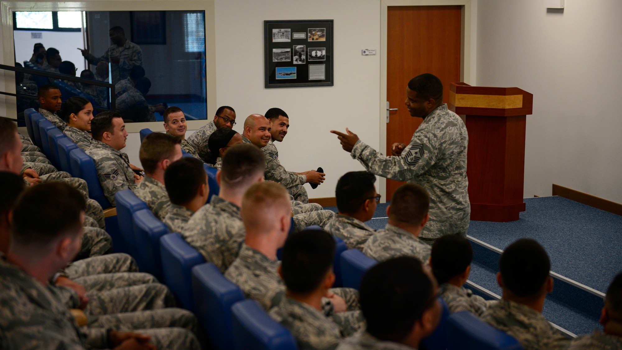 Chief Master Sgt. Phillip L. Easton, U.S. Air Forces in Europe and Air Forces Africa command chief, speaks with Airmen at Airmen Leadership School during a visit to Aviano Air Base, Italy, July 23, 2018. Easton mentioned several key words of advice to the Airmen on what it means to be a front-line supervisor in the Air Force. (U.S. Air Force photo by Staff Sgt. Cary Smith)