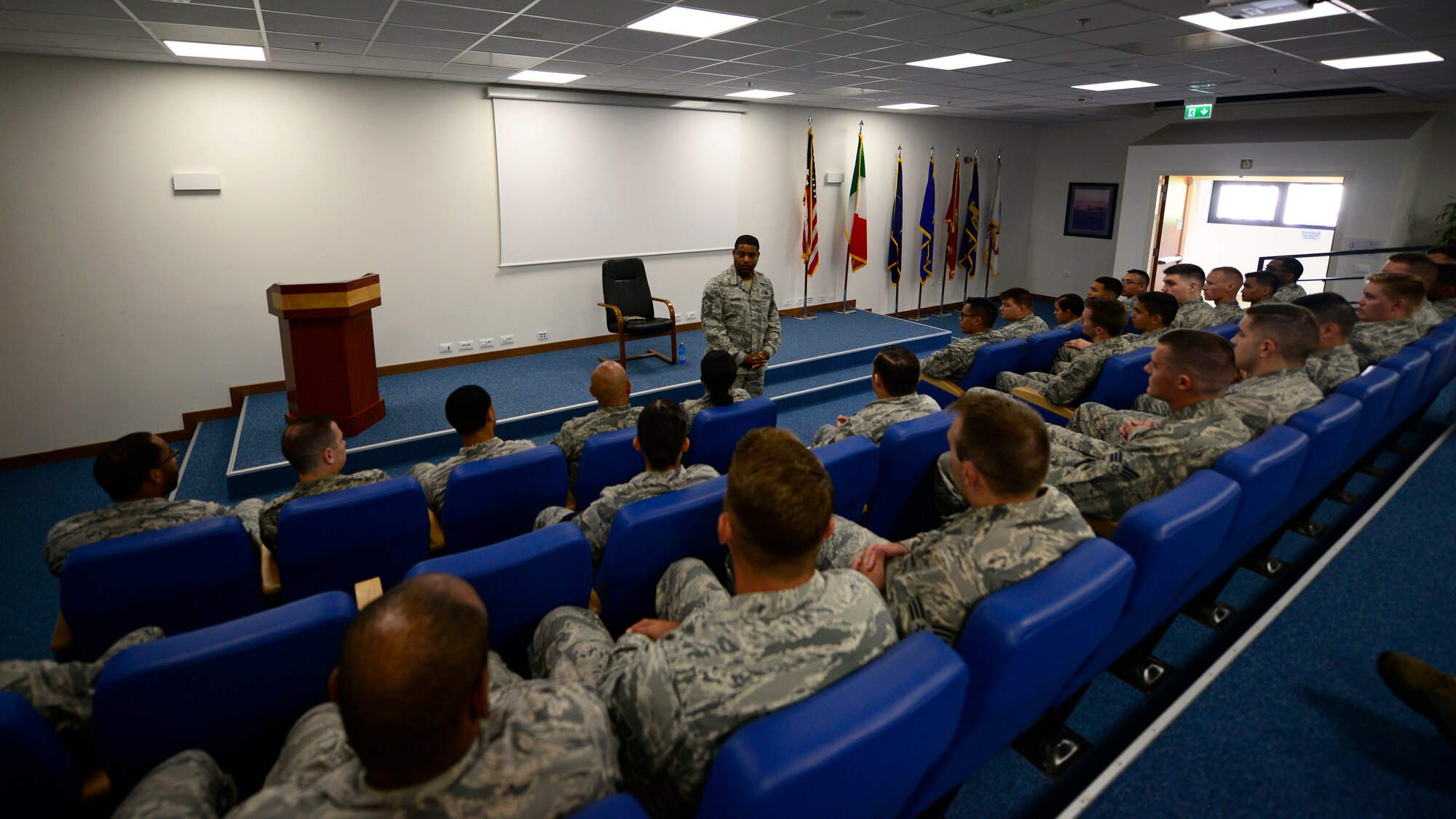 Chief Master Sgt. Phillip L. Easton, U.S. Air Forces in Europe and Air Forces Africa command chief, speaks with Airmen at Airmen Leadership School during a visit to Aviano Air Base, Italy, July 23, 2018. Easton mentioned several key words of advice to the Airmen on what it means to be a front-line supervisor in the Air Force. (U.S. Air Force photo by Staff Sgt. Cary Smith)