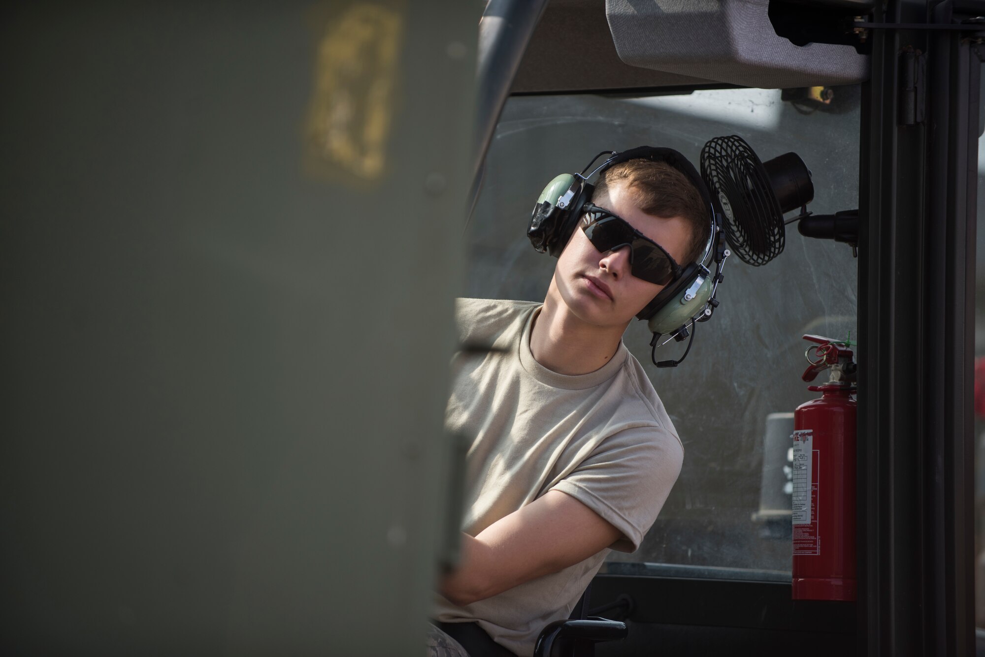 U.S. Air Force Airman 1st Class Dennis Fite, 100th Logistics Readiness Squadron ground transportation operator, uses a forklift to place an individual storage unit on a trailer at RAF Mildenhall, England, July 20, 2018. The section works closely with Traffic Management Office, inbound and outbound cargo and the cargo deployment function. (U.S. Air Force photo by Senior Airman Christine Groening)