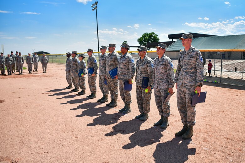 SCHRIEVER AFB, Colo. - Technical Sergeant selectees lead the Air Force Song during the Technical Sergeant Release Party, July 19th, 2018 at Schriever Air Force Base, Colorado. This marks the first time a promotion release party was held at the softball field, with selectees running the bases to celebrate being selected for promotion. (U.S. Air Force photo by Kathryn Calvert)