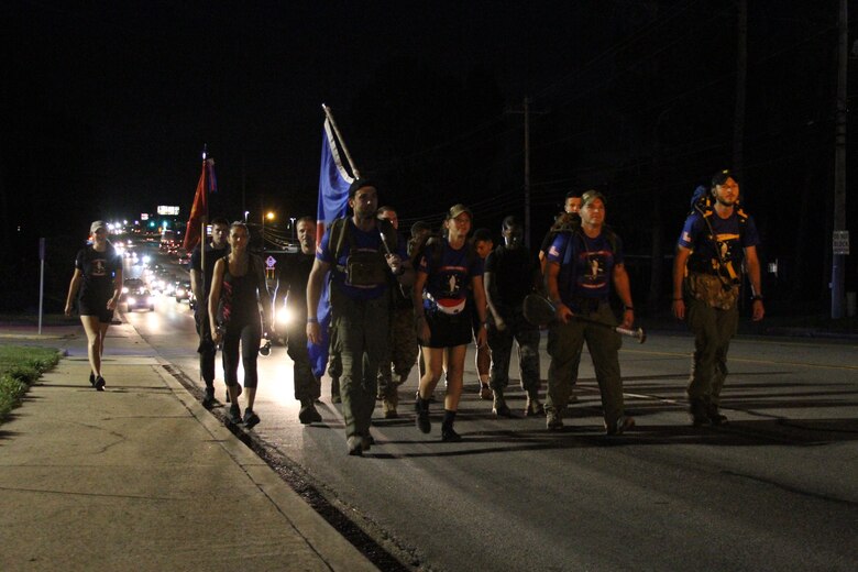 The Rucking Raiders were joined by Marine Corps Recruiting Station Columbia during their Marine Raider March on a portion of the 900 mile ruck on July 21, 2018, as they passed through Columbia, S.C. Marines and future Marines from RS Columbia joined the ruckers for 8 miles of their journey, to honor service members who lost their lives in a aircraft crash a year ago. To support the march, follow the Marine Raider Memorial March on Facebook and visit their website at http://www.ruckingraiders.com. (U.S. Marine Corps photo by Sgt. Tabitha Bartley)