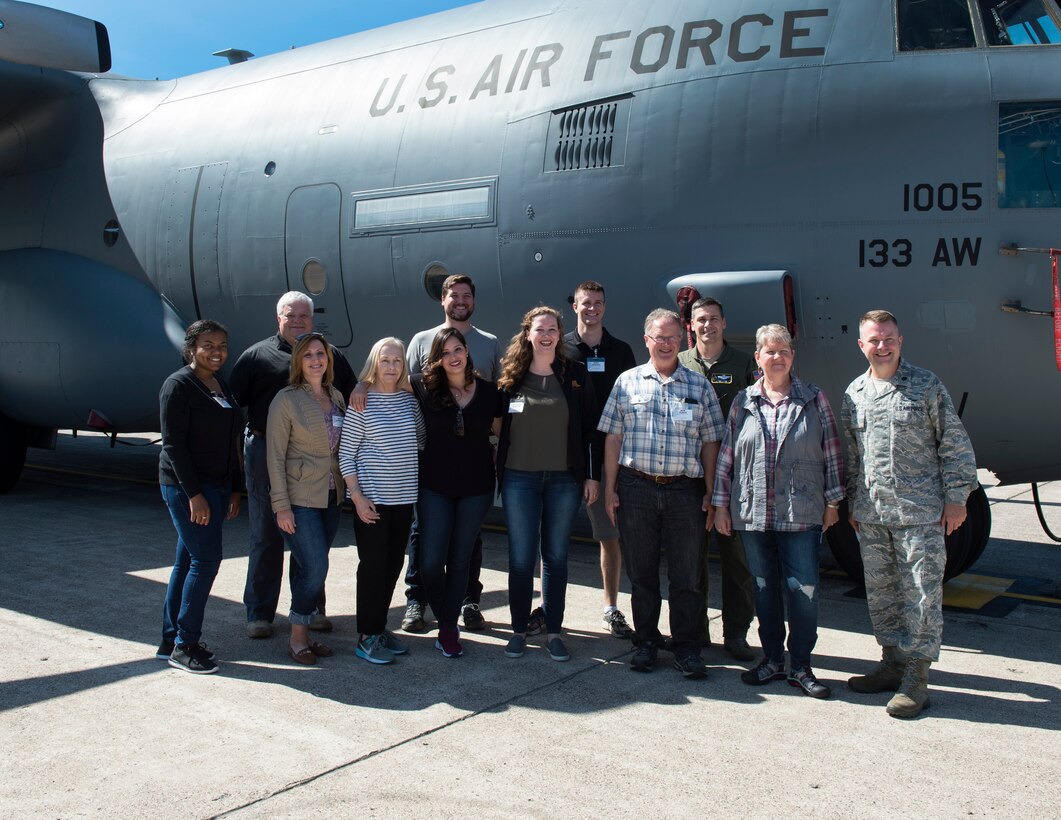 U.S. Air Force Airmen from the 133rd Airlift Wing and members of the Minnesota Congressional Delegation staff pose for a group photo in St. Paul, Minn., July 17, 2018.