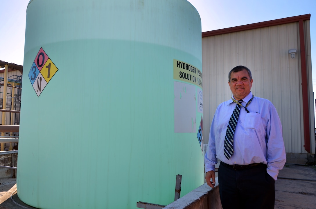 Jose Hurtado, program manager for the Air Force Civil Engineer Center’s environmental restoration division, stands next to groundwater cleanup equipment located on Joint Base San Antonio-Lackland, Texas.