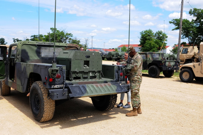 Sergeant 1st Class Chris Murray, right, information technology noncommissioned officer, 86th Training Division, reviews the issue documents for equipment with Isavette Torres, Fort McCoy Draw Yard, prior to accepting the vehicles and equipment for use during the 86th TDs Combat Support Training Exercise (CSTX) July 18.
