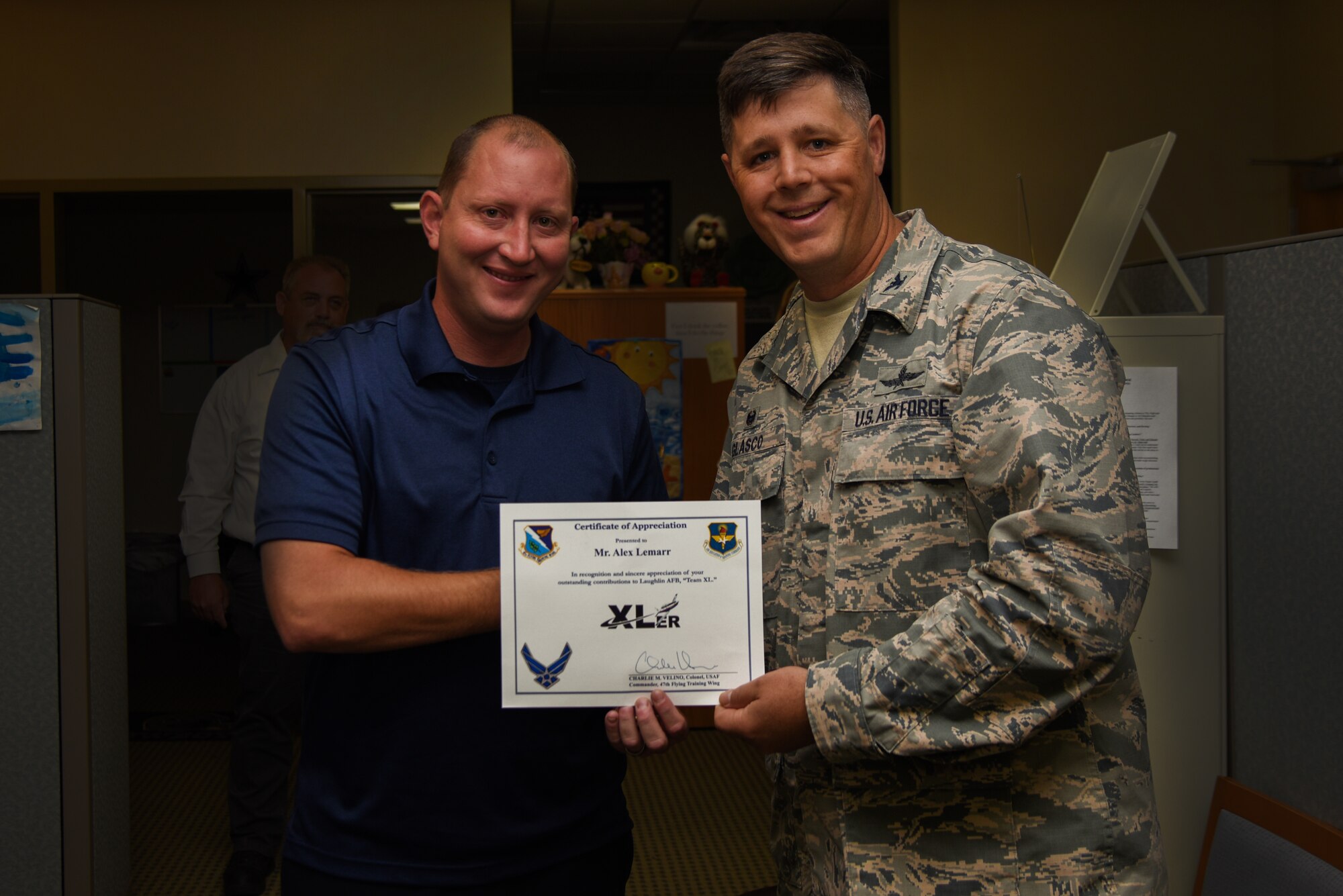 Alex Lemarr, 47th Maintenance Directorate T-6 aircraft scheduler, was chosen by wing leadership to be the “XLer” of the week, for the week of July 16, 2018, at Laughlin Air Force Base, Texas. The “XLer” award, presented by Col. Ted Glasco, 47th Mission Support Group commander, is given to those who consistently make outstanding contributions to their unit and the Laughlin mission. (U.S. Air Force photo by Airman 1st Class Marco A. Gomez)
