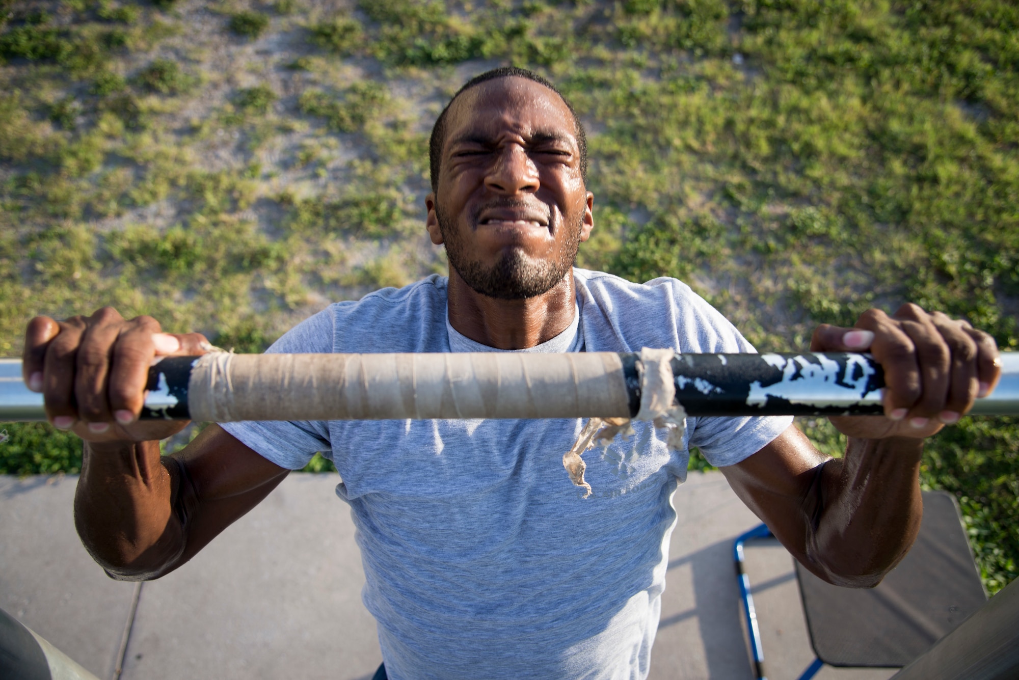 U.S. Air Force Airman 1st Class Quon Green, an entry controller assigned to the 6th Security Force Squadron, performs a pull up at MacDill Air Force Base, Florida, July 17, 2018.