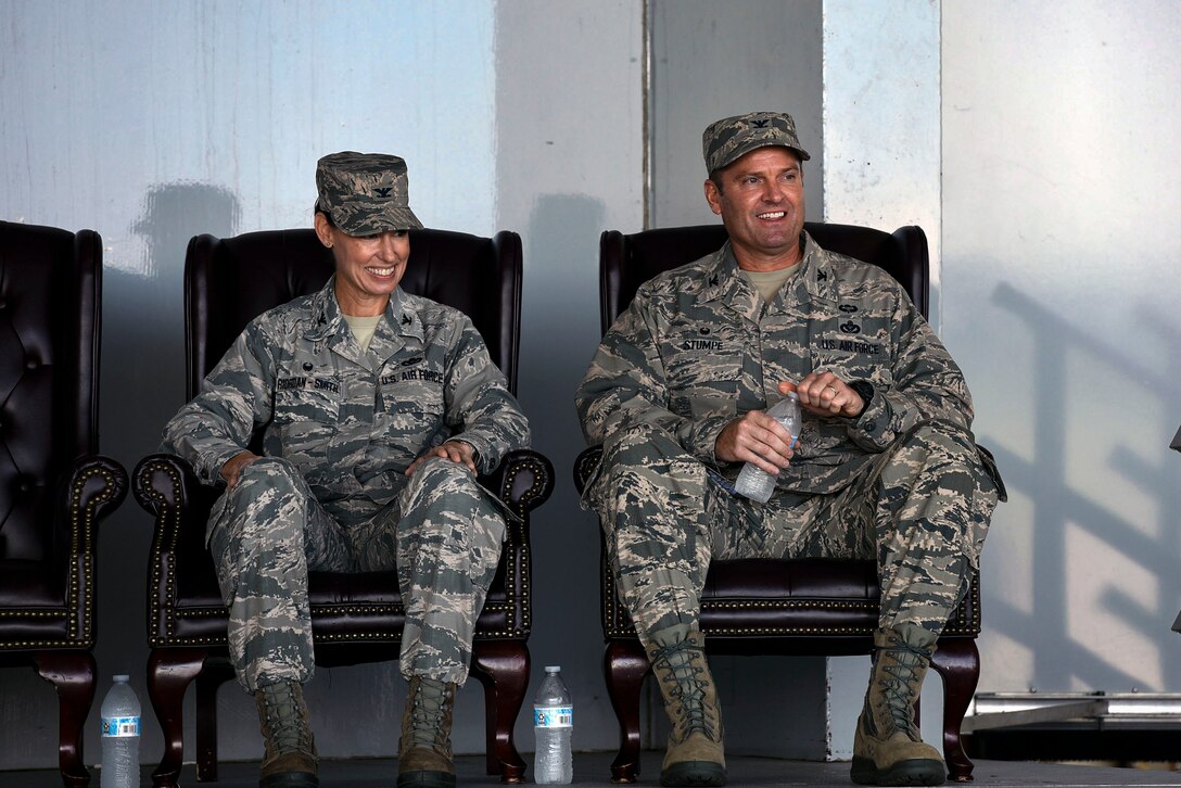 Col. Susan Riordan-Smith, left, 23d Mission Support Group commander, shares a laugh with Col. Brian Stumpe, incoming 23d MSG commander, during a change of command ceremony, July 25, 2018 at Moody Air Force Base, Ga. The 23d MSG recognized the formal transfer of authority and responsibility for their unit as Col. Susan Riordan-Smith relinquished command to Col. Brian Stumpe. The 23d MSG is comprised of six squadrons with approximately 1,500 personnel dedicated to training, equipping and deploying personnel support forces to build, protect and sustain air bases worldwide for combat air operations. (U.S. Air Force photo by Senior Airman Greg Nash)
