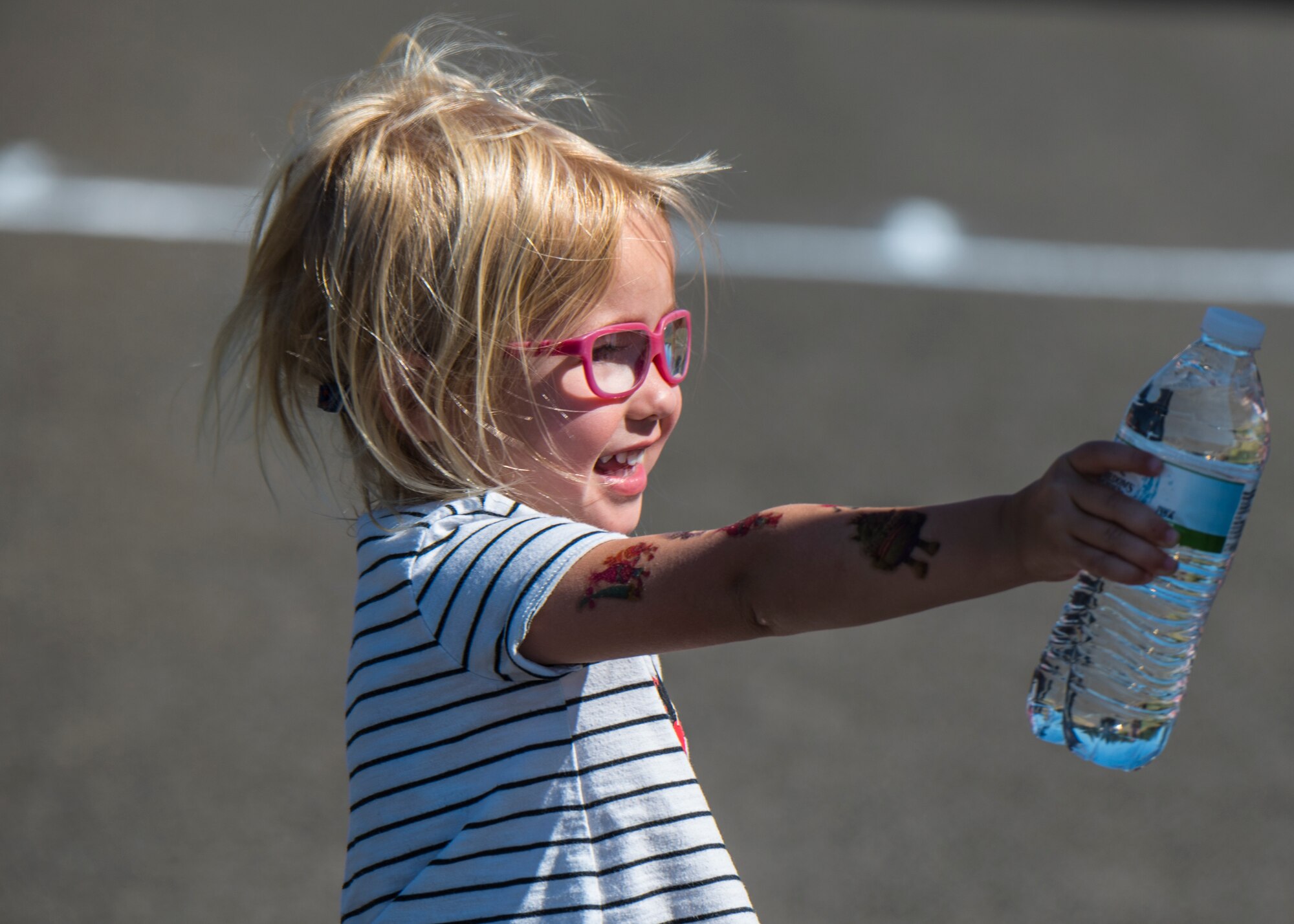 Team Fairchild families attended the 14th annual Clear Lake Triathlon to cheer on competitors at Medical Lake, Washington, June 21, 2018. June 21, 2018. The sprint triathlon allows Airmen and their families to boost morale and build community through teamwork and comradery. (U.S. Air Force photo/ Airman 1st Class Whitney Laine)
