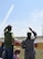 Colonel Stacy Jo Huser, 90th Missile Wing Commander, and spouse Tim O'Hara, watch the U.S. Air Force Thunderbirds perform a Delta formation during the Cheyenne Frontier Days Air Show in Cheyenne, Wyo., July 25, 2018. The Thunderbirds performed stunts such as the calypso pass and a maneuver in tribute to America's veterans and fallen heroes. The airshow provides a chance for the local community and worldwide visitors of CFD to see the U.S. Air Force in action over the skies of Cheyenne. (U.S. Air Force photo by Glenn S. Robertson)