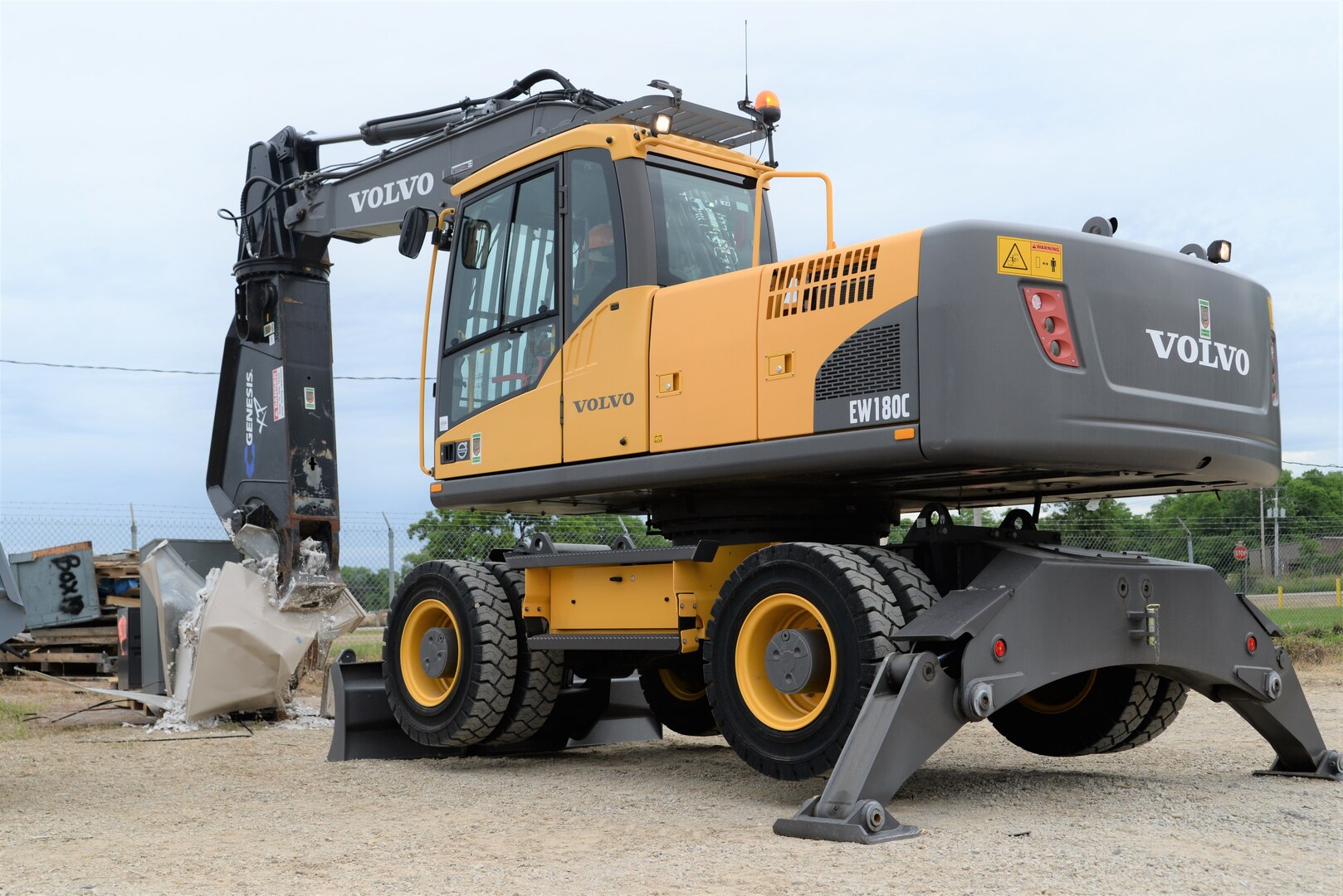 A participant in this year’s Overseas Contingency Operations Readiness Training uses heavy equipment to properly dispose of unused equipment June 19 at Fort Custer, Michigan. The training consisted of 62 attendees with half of them being civilians and the other half military reservists from the Navy, Army and Air Force assigned to DLA Disposition Services. Photo by Air Force Master Sgt. J. Scott Mathews.