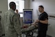 Dominic Trujillo-Hobbs, 374th Medical Group simulation operator, briefs Col. Otis C. Jones, 374th Airlift Wing commander, about the role the simulation lab has in ensuring properly trained medical personnel during the 374 MDG immersion tour at Yokota Air Base, Japan, July 24, 2018.