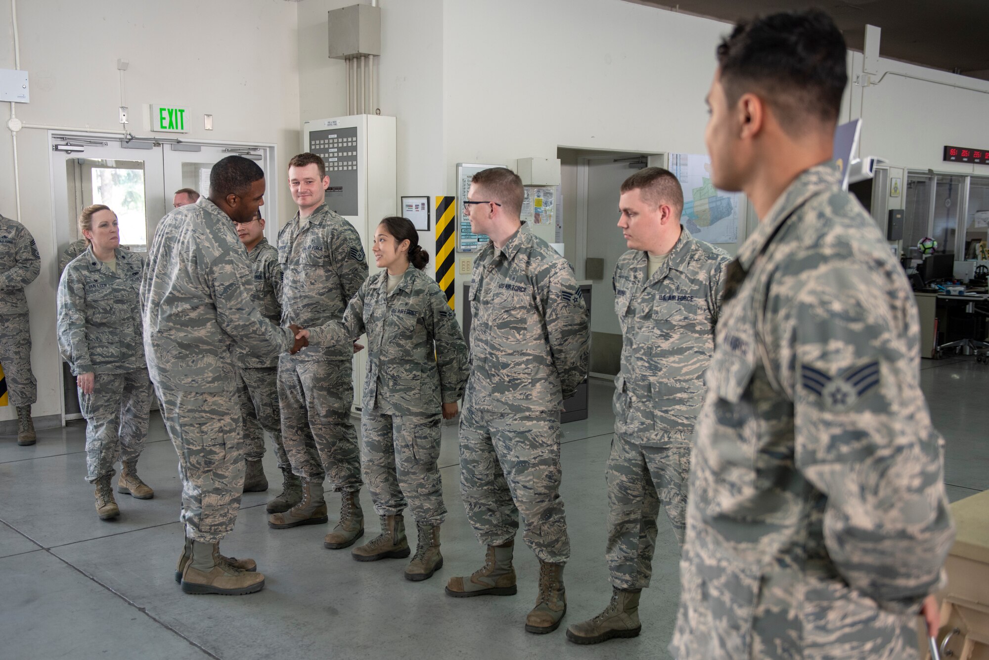 Col. Otis C. Jones, 374th Airlift Wing commander, shakes hands with the Airmen of the 374th Medical Support Squadron during the 374th Medical Group immersion tour at Yokota Air Base, Japan, July 24, 2018.