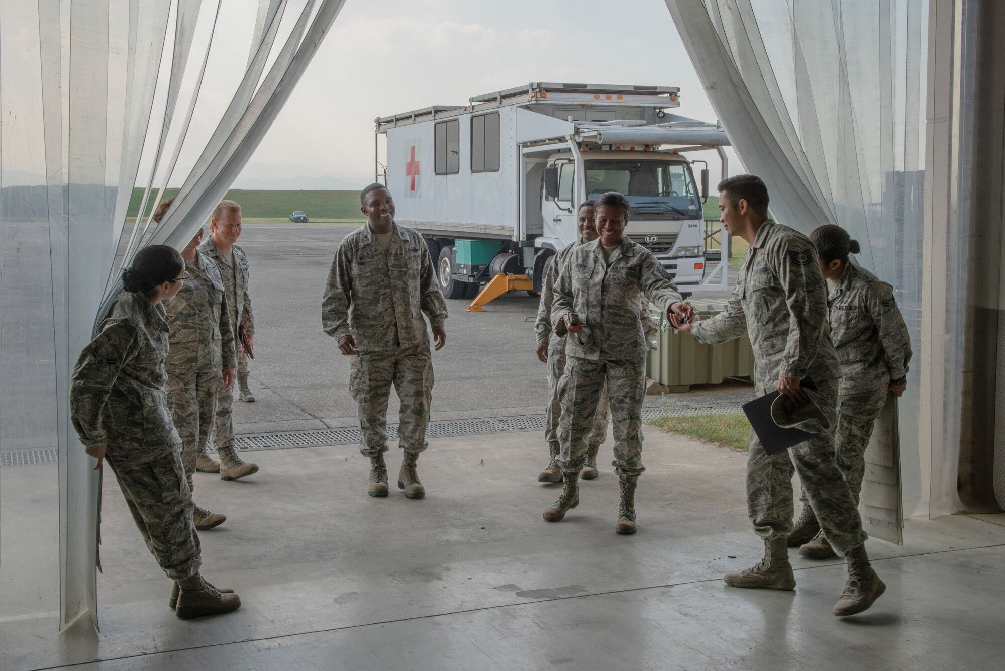 Col. Otis C. Jones walks with the leadership of the 374th Medical Group after an En Route Patient Staging System demonstration during the 374 MDG immersion tour at Yokota Air Base, Japan, July 24, 2018.