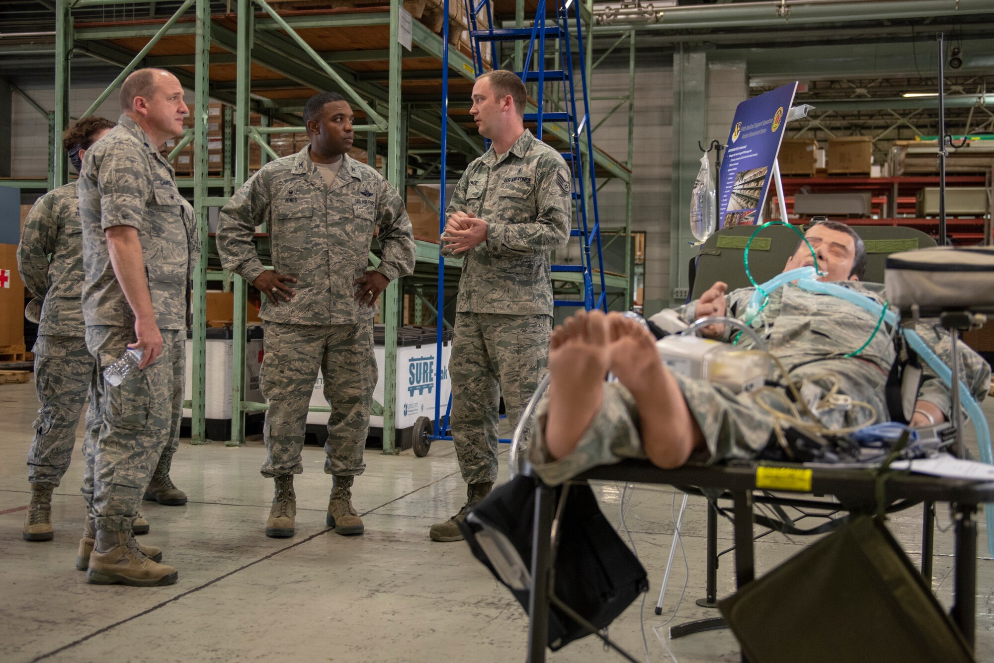 Staff Sgt. Shane Page, 374th Medical Support Squadron NCO in charge of patient movement items, briefs Col. Otis C. Jones, 374th Airlift Wing commander, about Yokota’s patient movement capability during the 374th Medical Group immersion tour at Yokota Air Base, Japan, July 24, 2018.