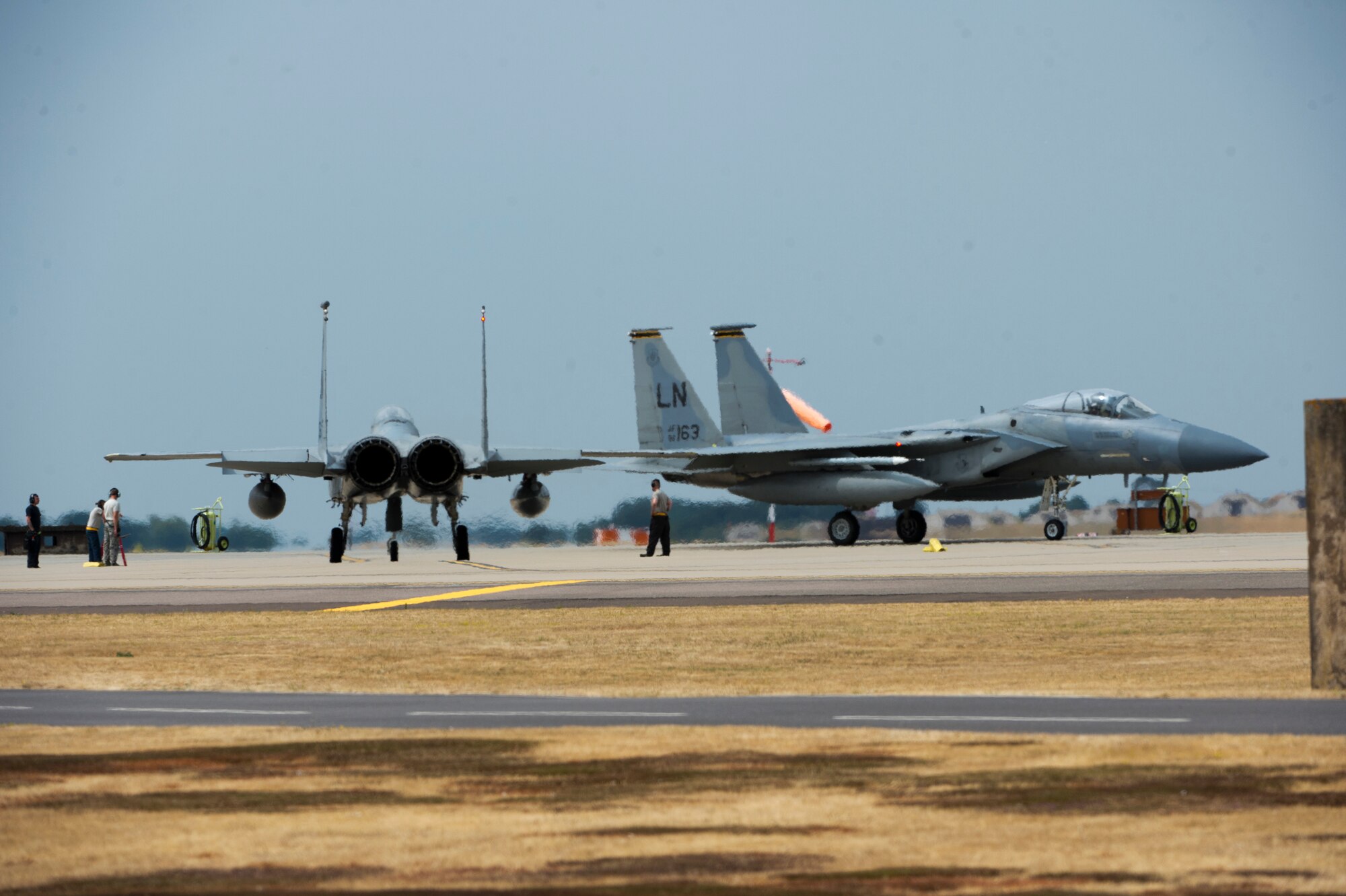 F-15C Eagles from the 493rd Fighter Squadron taxi to the runway at Royal Air Force Lakenheath, England, July 20, 2018.