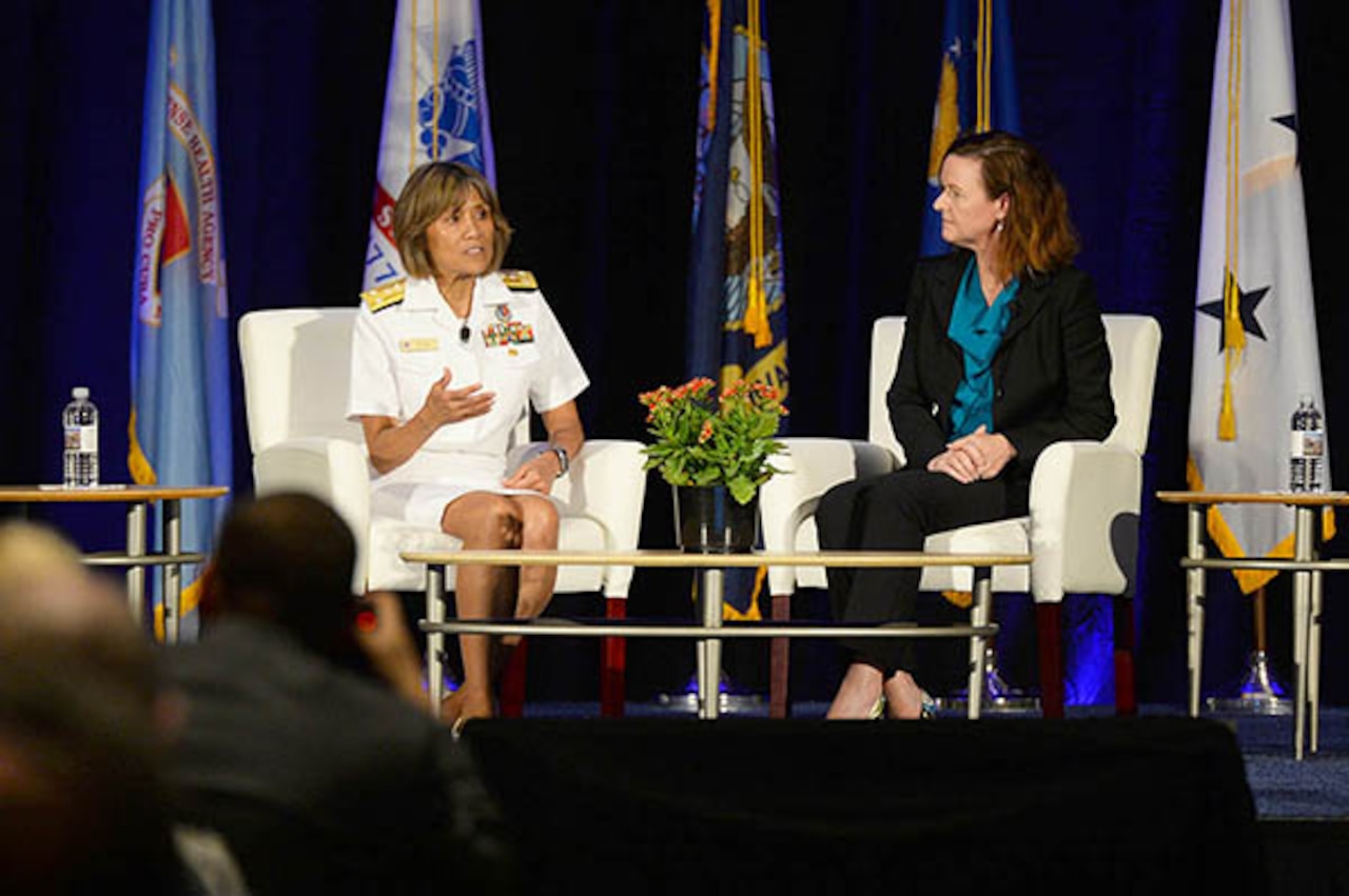 Navy Vice Adm. Raquel C. Bono, director of the Defense Health Agency, and Stacy Cummings, program executive officer for Defense Health Management Systems, answer questions about the progress of MHS GENESIS electronic health record, during the 2018 Defense Health Information Technology Symposium in Orlando, Fla., July 24, 2018. DoD photo
