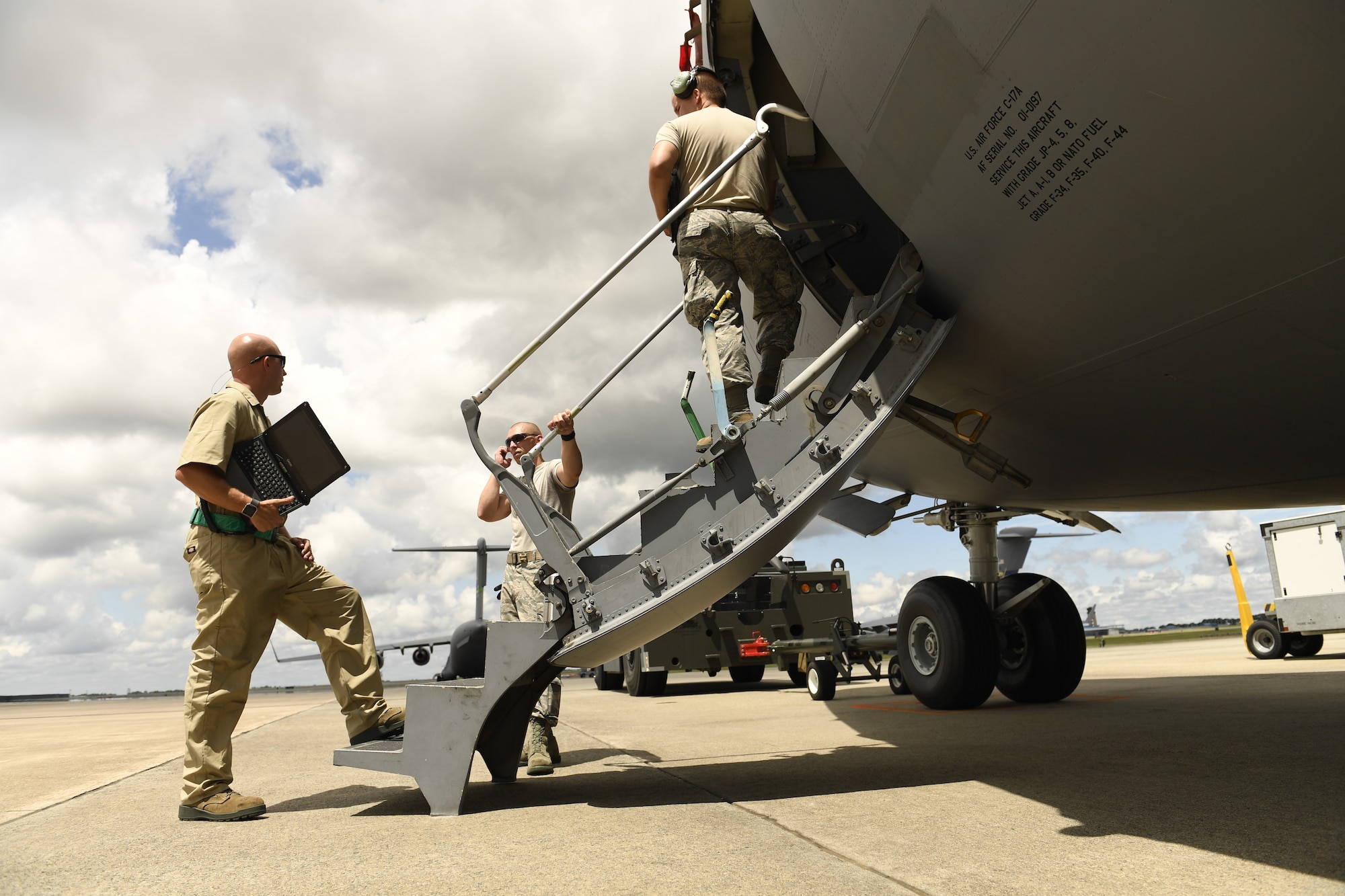 Members of the 145th Aircraft Maintenance Squadron conduct a tow briefing prior to towing a C-17 Globemaster III aircraft at the North Carolina Air National Guard Base, Charlotte Douglas International Airport, July 24, 2018. The tow briefing ensures that each crew chief knows their role and responsibility to mitigate any safety risks.