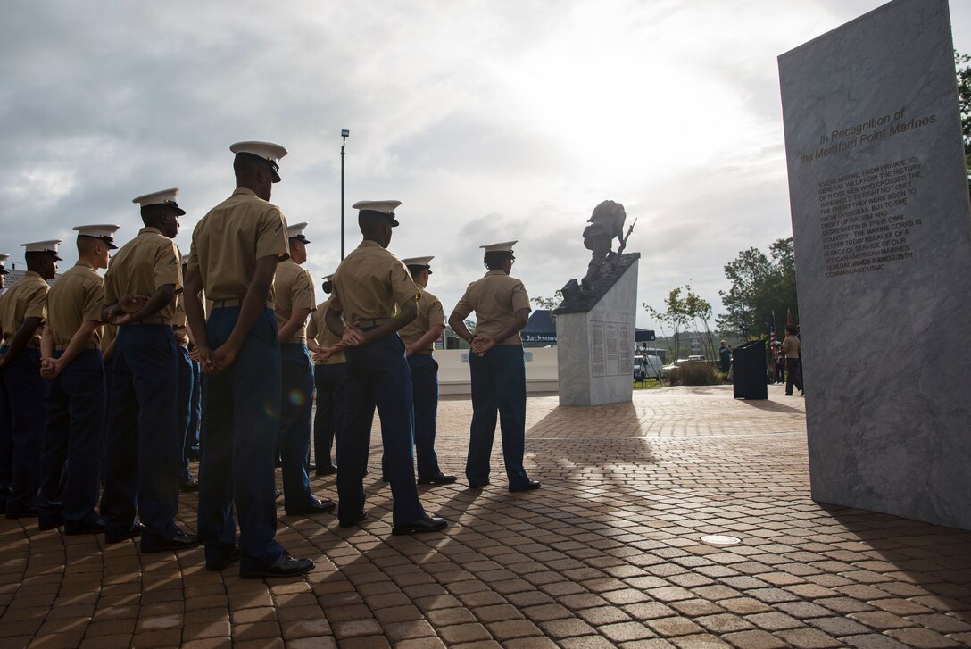 Marines with 2nd Supply Battalion, 2nd Marine Logistics Group, stand in formation during the Montford Point Marine Memorial gifting ceremony at the Montford Point Marine Memorial in Jacksonville, N.C., July 25, 2018. The Montford Point Marine Memorial is dedicated to the first African Americans to serve in the United States Marine Corps and captures the historical impact and positive changes the Montford Point Marines have had on our country.