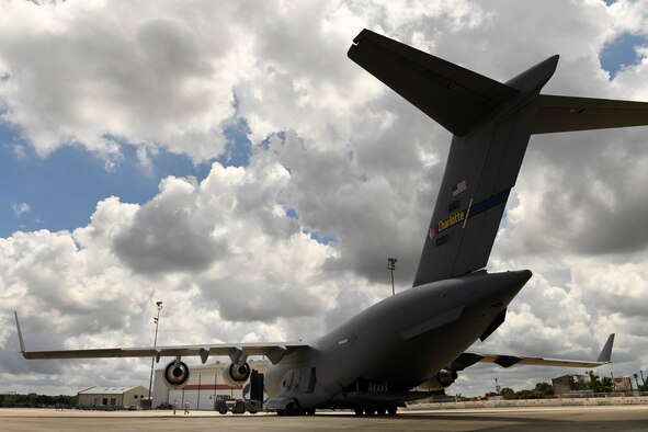 Members of the 145th Aircraft Maintenance Squadron (AMXS) prepare to tow a C-17 Globemaster III aircraft at the North Carolina Air National Guard Base, Charlotte Douglas International Airport, July 24, 2018. Since the aircraft conversion in April, the 145th AMXS is working to train maintenance personnel with a goal of them being fully qualified.