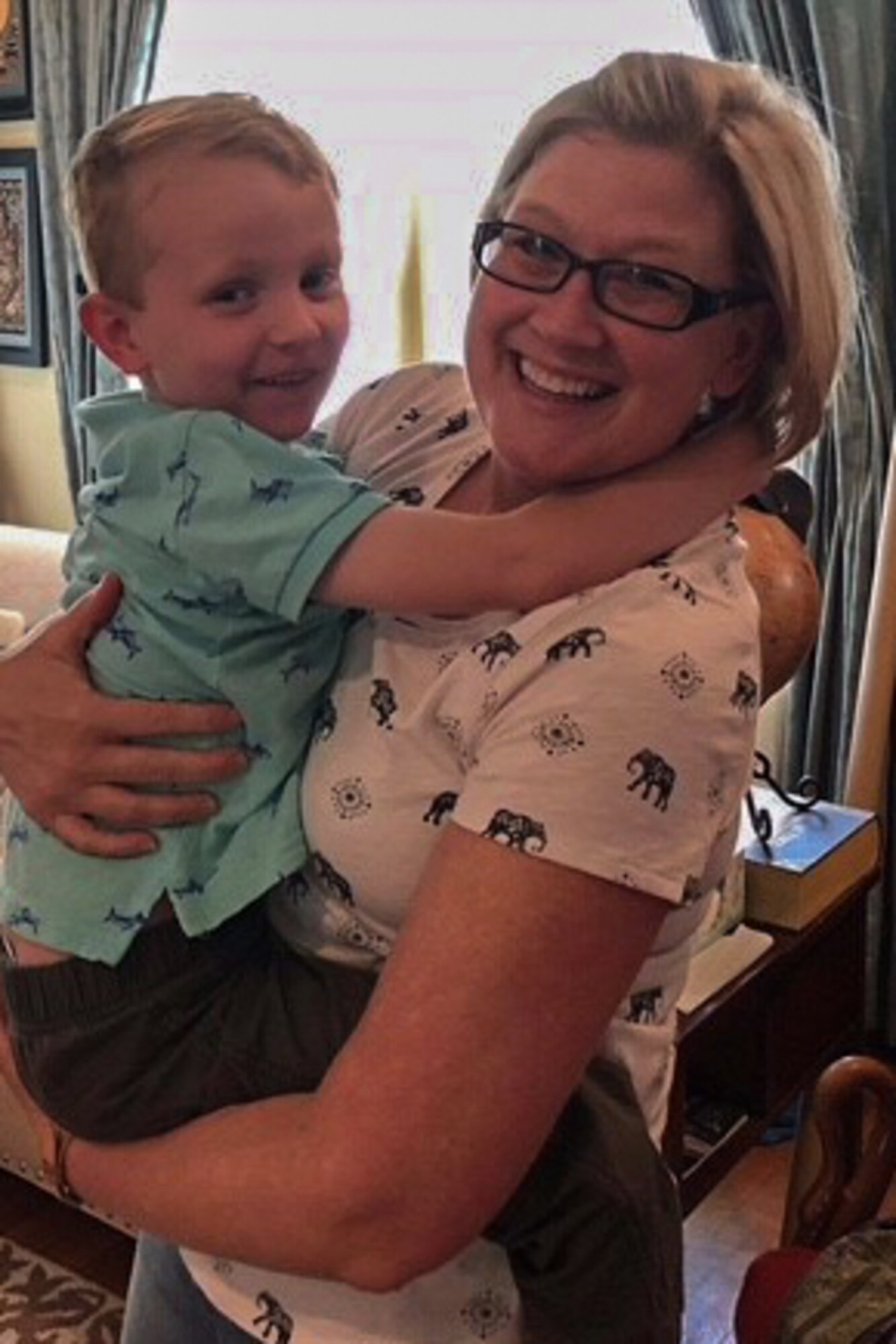 U.S. Air Force Chief Master Sgt. Shelley Cohen, 307th Bomb Wing command chief, hugs Matt Hesni in Alexandria, Louisiana, June 17, 2018.  He was involved in a serious traffic accident with his father, Jason Hesni, and mother, Amy Hesni, on May 24, 2018.  Jason Hesni sustained a cut to his brachial artery during the accident.  Cohen, who happened upon the accident, was able to improvise a tourniquet to keep him from bleeding to death. (courtesy photo)