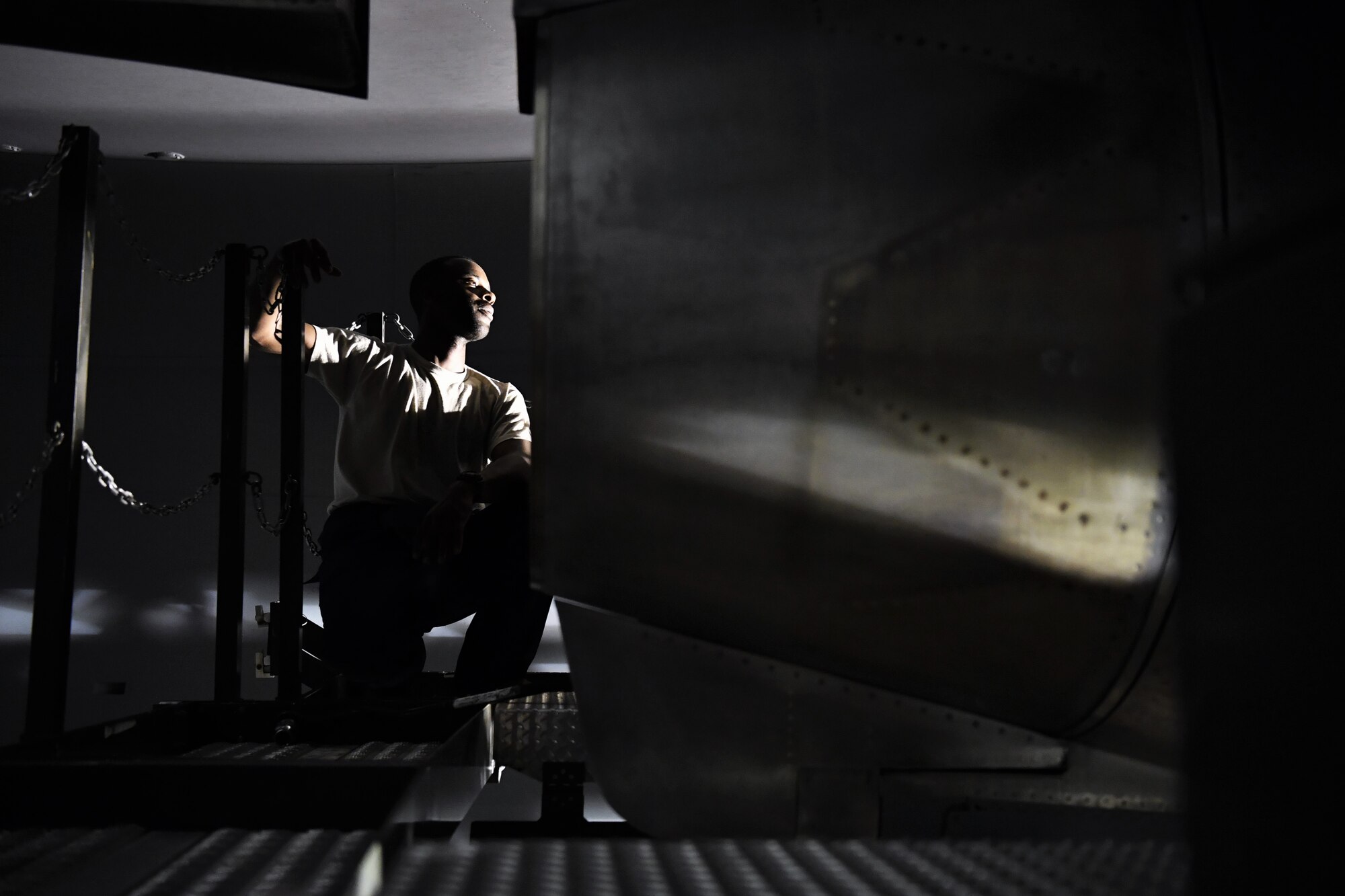 Staff Sgt. Reuben Bowers, 721st Air Mobility Operations Group airlift specialist mission maintenance craftsman, inspects an engine on a C-17 Globemaster III aircraft July 19, 2018, at an undisclosed location in Southwest Asia. Bowers and his fellow Airmen assisted in the transport and installation of the engine from Ramstein Air Base, Germany. (U.S. Air Force photo by Staff Sgt. Christopher Stoltz)