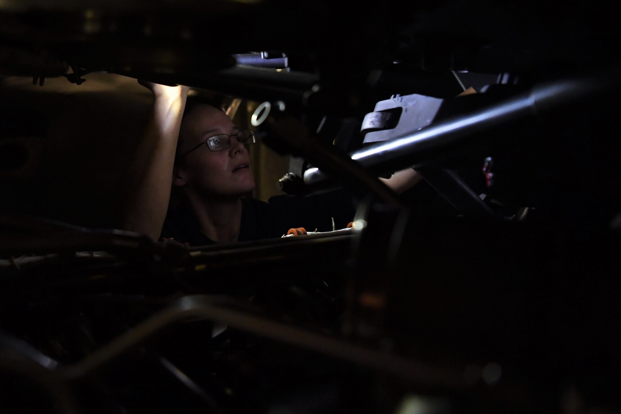 Staff Sgt. Misti Rosas, 5th Expeditionary Air Mobility Squadron aircraft maintainer, assists with the install of an engine on a C-17 Globemaster III aircraft July 19, 2018, at an undisclosed location in Southwest Asia. A single engine on a C-17 can weigh in excess of 10,000-pounds. (U.S. Air Force photo by Staff Sgt. Christopher Stoltz)