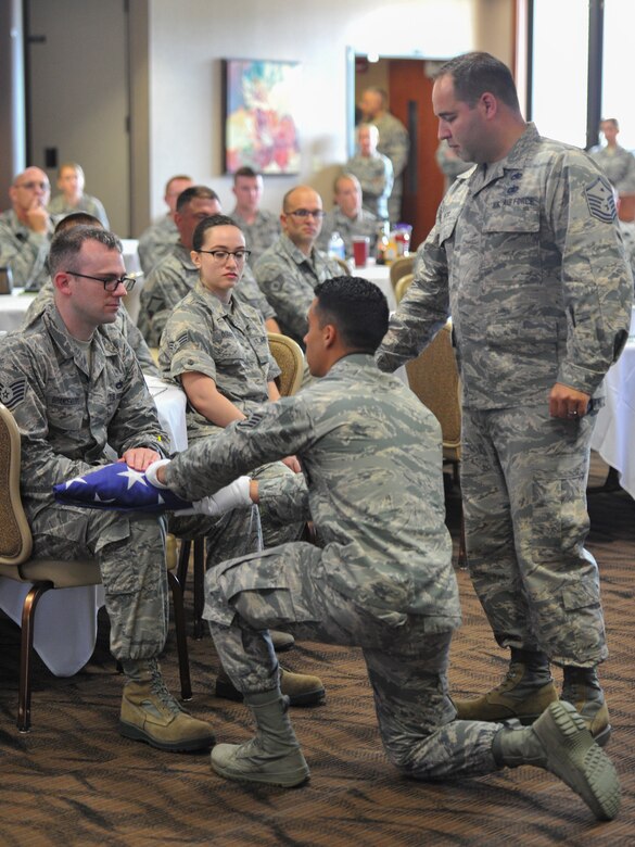A six-person honor guard, made up of volunteer 910th Airlift Wing Reserve Citizen Airmen and Ohio Air National Guard Airmen, demonstrated a funeral honors ceremony July 25, 2018, during a Ohio Air National Guard Enlisted Leadership Symposium that was held in the Community Activity Center on Youngstown Air Reserve Station.