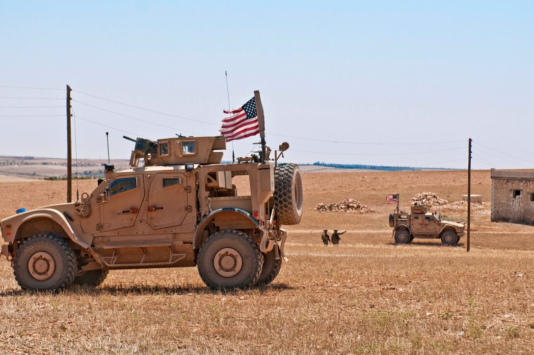 U.S. soldiers provide security during a coordinated, independent patrol.