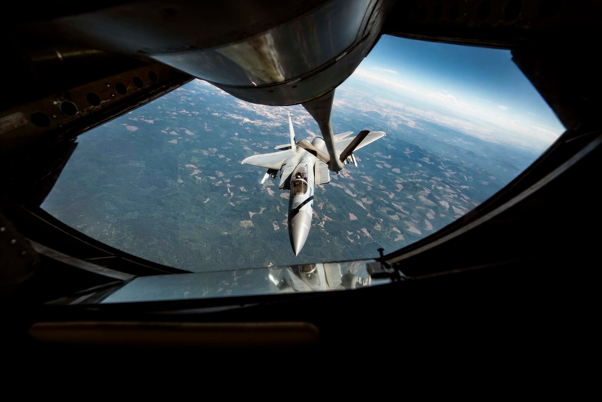 An F-15A Eagle from the 142nd Fighter Wing in Portland, Ore. approaches a KC-135 Stratotanker to refuel during the Aerospace Control Alert CrossTell exercise July 24, 2018 over western Oregon. CrossTell is a three-day exercise involving multiple Air National Guard units, the Civil Air Patrol, and U.S. Coast Guard rotary-wing air intercept units to conduct training scenarios to replicate airborne intercepts designed to safely escort violators out of restricted airspace. (U.S. Air National Guard photo by Staff Sgt. Rose M. Lust)