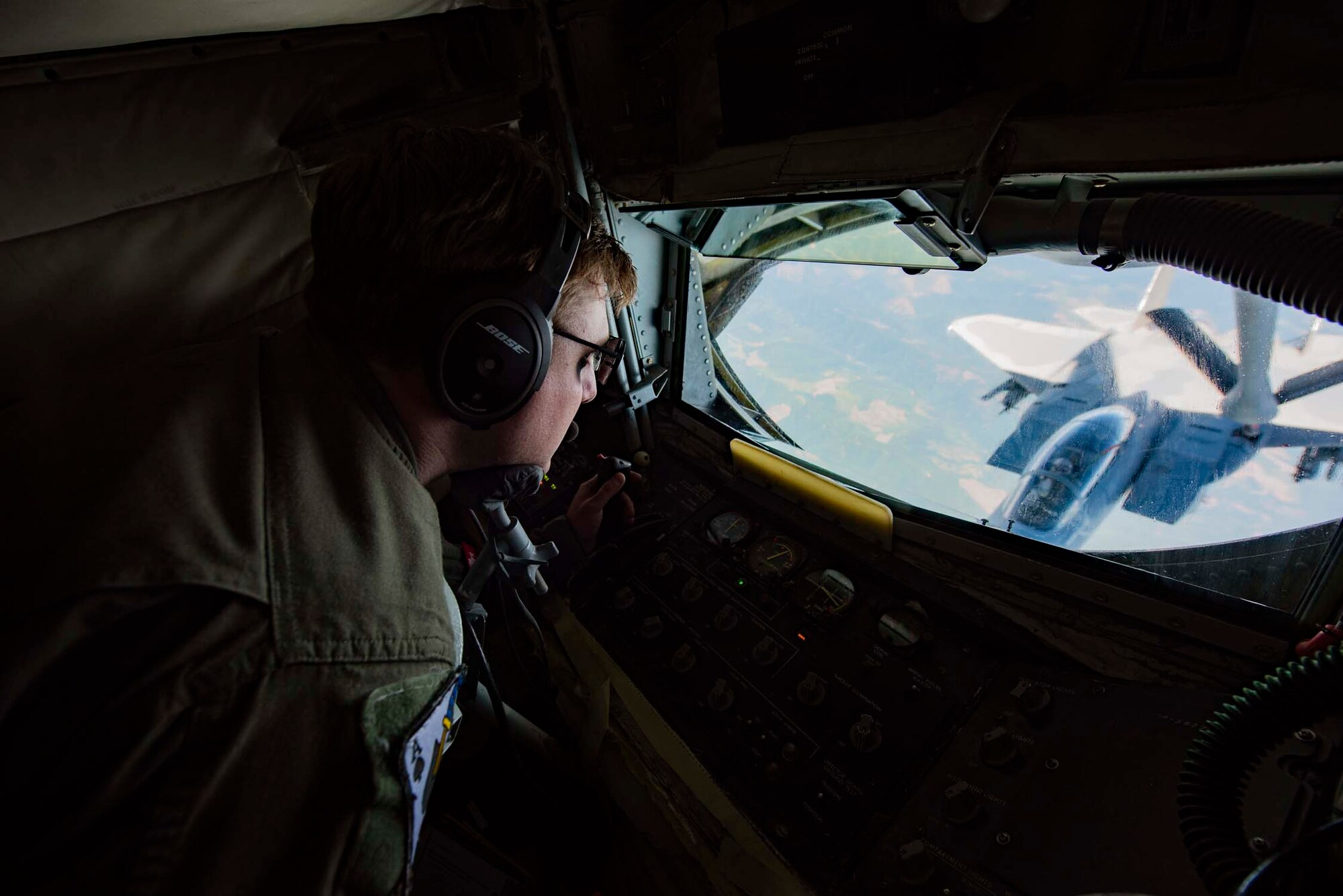 Staff Sgt. Chas Cramer, a boom operator with the 116th Air Refueling Squadron, transfers fuel to an F-15A Eagle from the 142nd Fighter Wing during Aerospace Control Alert CrossTell training exercise July 24, 2018 over western Oregon. CrossTell is a three-day exercise involving multiple Air National Guard units, the Civil Air Patrol, and U.S. Coast Guard rotary-wing air intercept units to conduct training scenarios to replicate airborne intercepts designed to safely escort violators out of restricted airspace. (U.S. Air National Guard photo by Staff Sgt. Rose M. Lust)