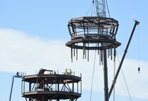 The cab for the new air traffic control tower was hoisted and positioned in place by contractors July 13. The new tower is expected to be complete by March 2019.
