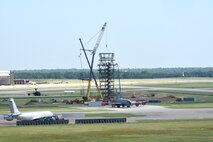 Looking from the catwalk of the old air traffic control tower, the cab for the new air traffic control tower was hoisted and positioned in place by contractors July 13. The new tower is expected to be complete by March 2019.