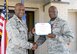 72nd Air Base Wing Commander Col. Kenyon Bell presented The Legion of Merit to Vice Commander Col. Thomas Brown in an outdoor ceremony at the 72ABW Headquarters July 11.