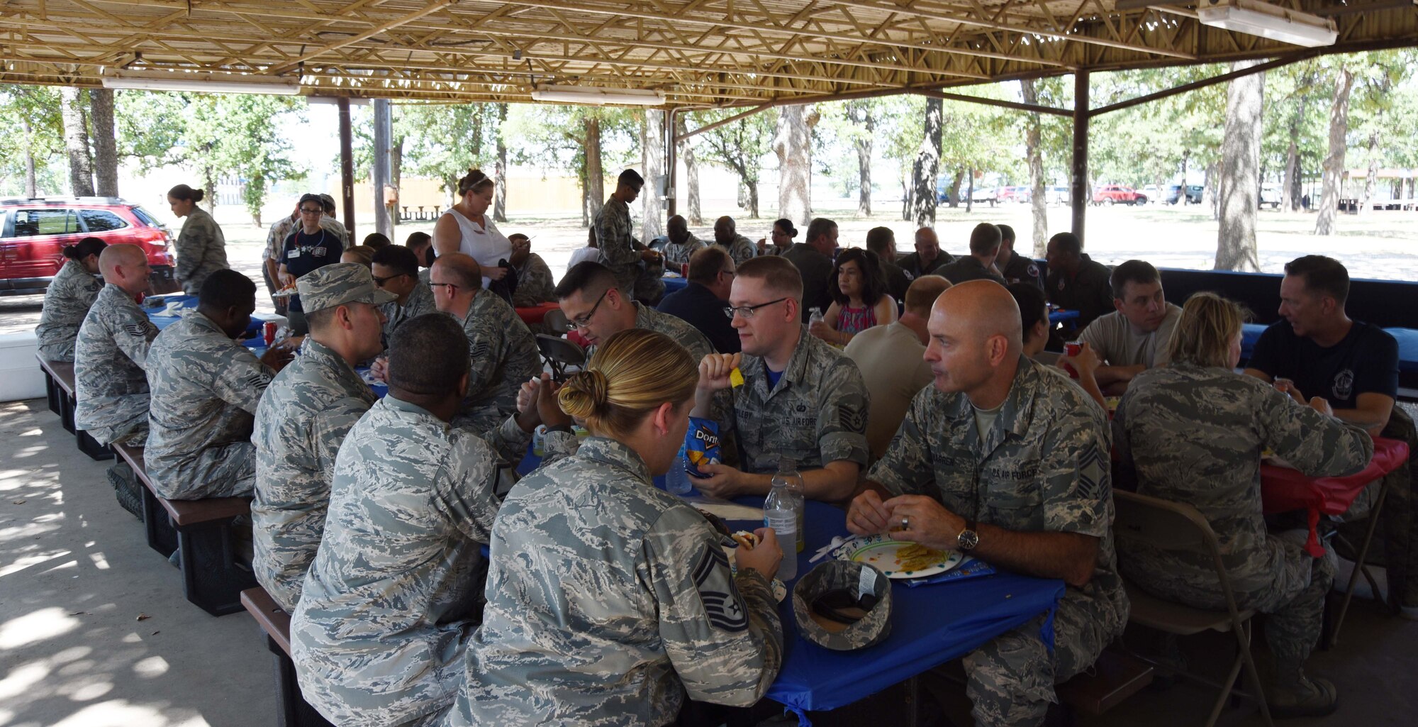 Airmen from the 301st Fighter Wing’s force support squadron, wing staff, communication squadron, and operations group take a break from unit training assembly duties to eat a barbecue lunch provided by the Dallas/Fort Worth United Service Organization (USO), July 15, 2018. The USO works to lift the spirits of America’s troops and their families at USO Centers and through morale-boosting and family-strengthening programs targeting service members stationed in DFW. (U.S. Air Force photo by Tech. Sgt. Charles Taylor)